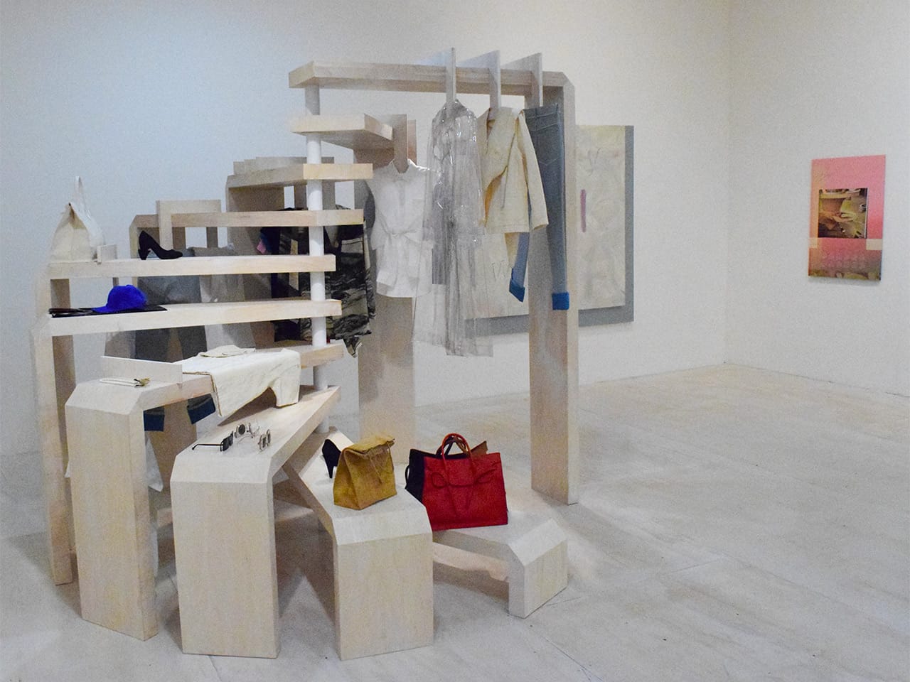 An installation and objects by Slow and Steady Wins the Race (left) and a painting by Seth Price (right)