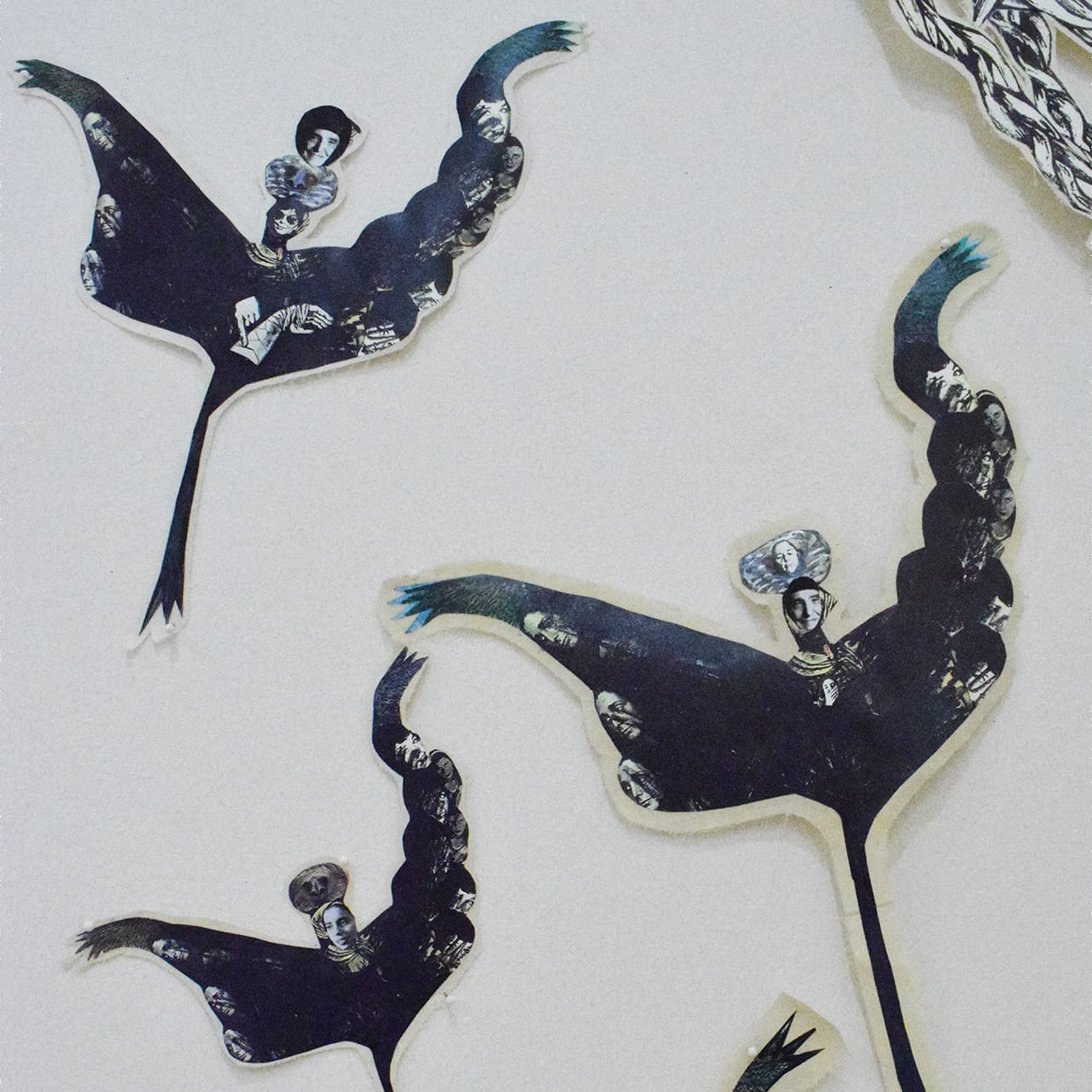 Detail of Mary Beth Edelson's installation, with collage images of Louise Bourgeois, Yoko Ono, Ana Mendieta, and other women artists