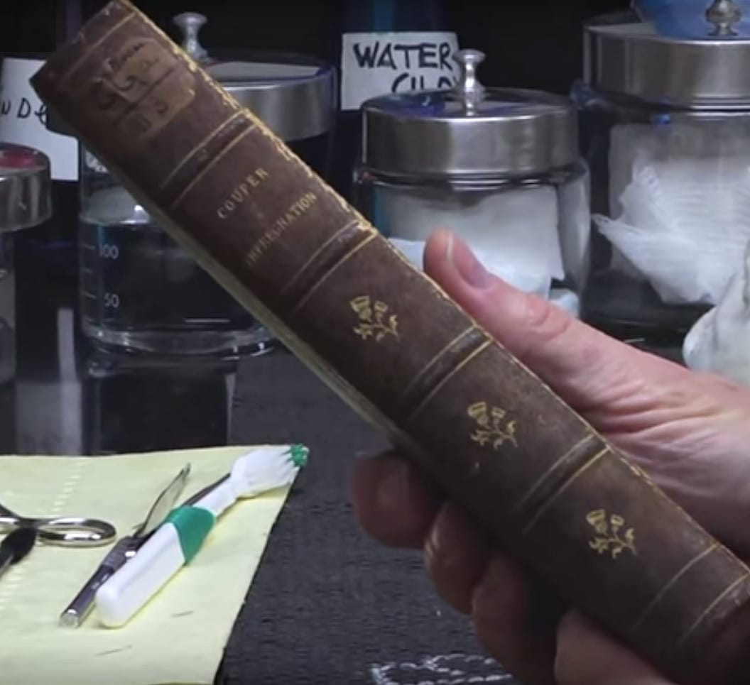 A book bound in human skin at the Mütter Museum (screenshot via YouTube)