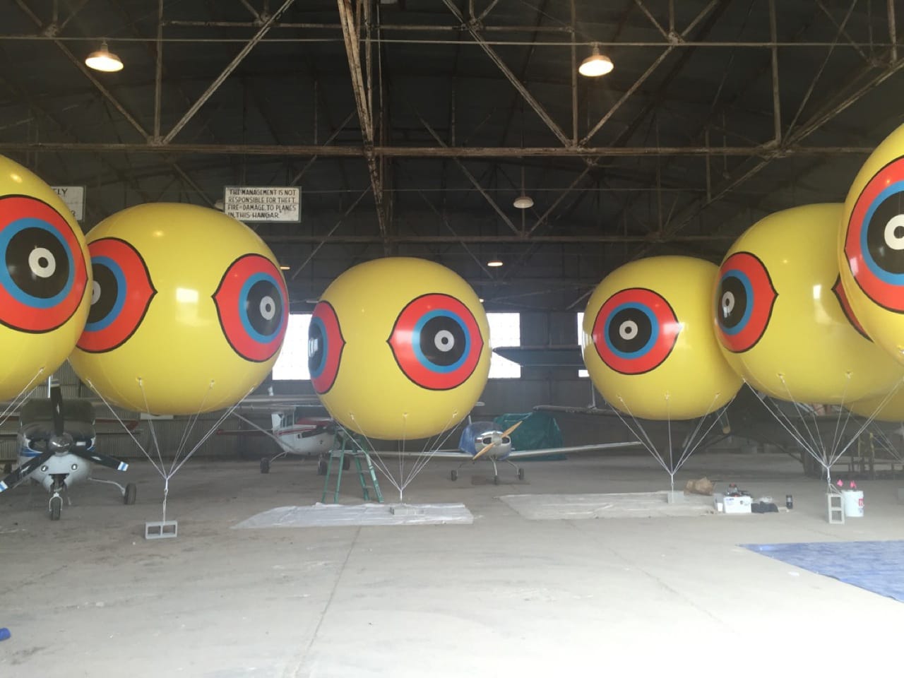 The balloons for "Repellent Fence" were stored in an airplane hangar at the Douglas Airport before being taken out to the desert.