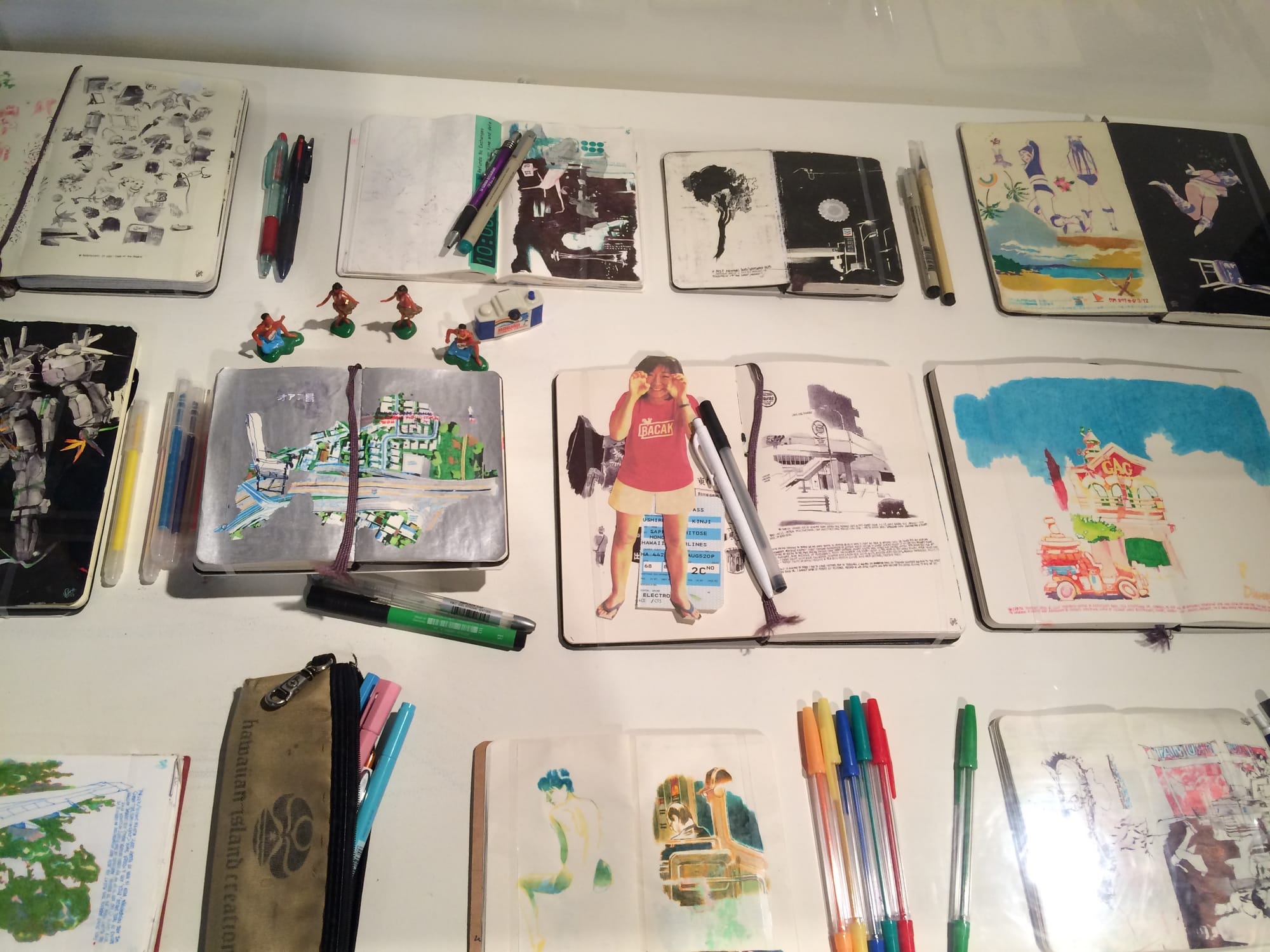 Display of sketchbooks by Edwin Ushiro at the Japanese American National Museum