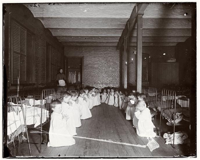 "Prayer-Time in the Nursery, Five Points House of Industry," photo by Jacob A. Riis and unknown (1887-1888) (courtesy Museum of the City of New York, Gift of Roger William Riis)