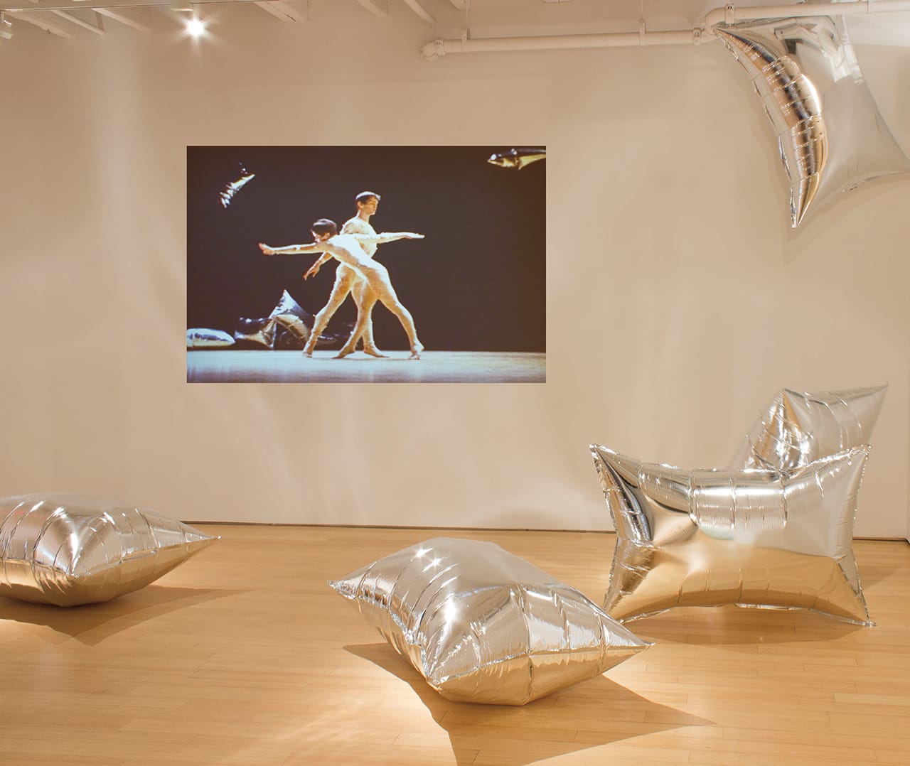 Merce Cunningham's 'Rainforest' (1968) installed with Andy Warhol's “Silver Clouds”