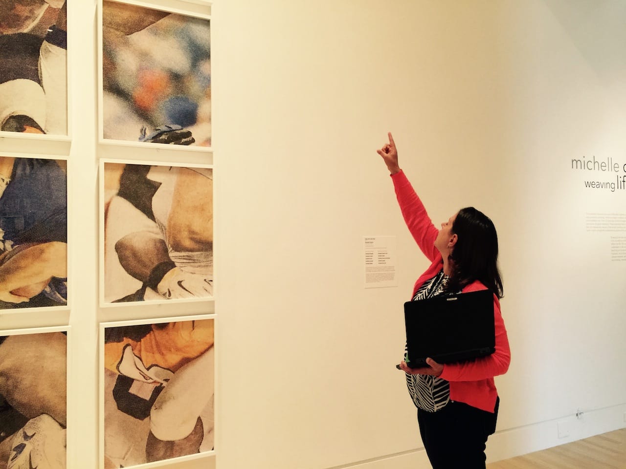 Susie McKenna, IMA's director of marketing, points to details in Grabner's salute to the Indianapolis Colts