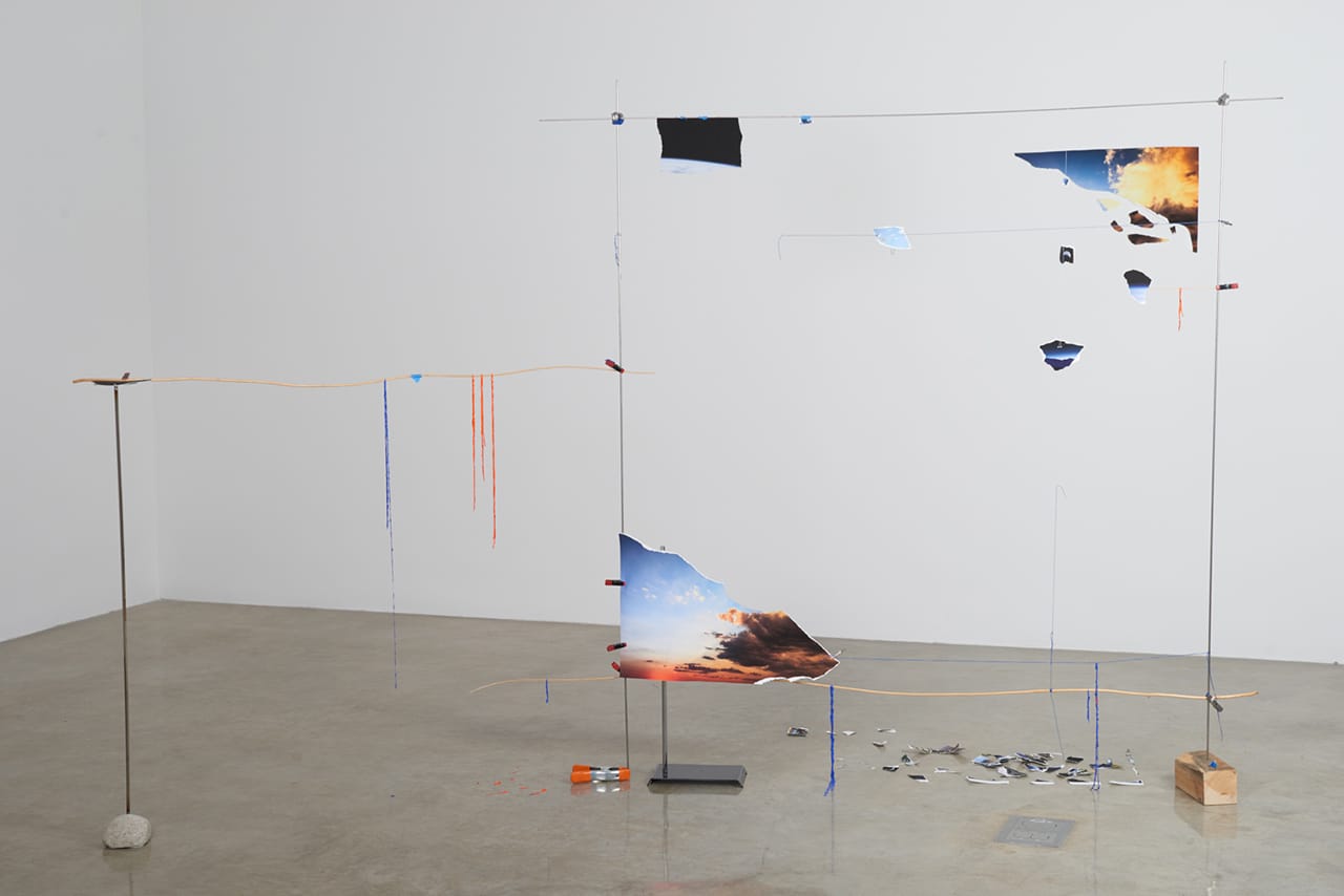 Sarah Sze, "Lost Image Standing (Fragment Series)" (2015), acrylic paint, archival prints, string, stainless steel, stone, wood, clamps, 72 1/2 x 109 x 41 in (184.2 x 276.9 x 104.1 cm) (photo by Brett Moen, courtesy the artist and Tanya Bonakdar Gallery, New York)