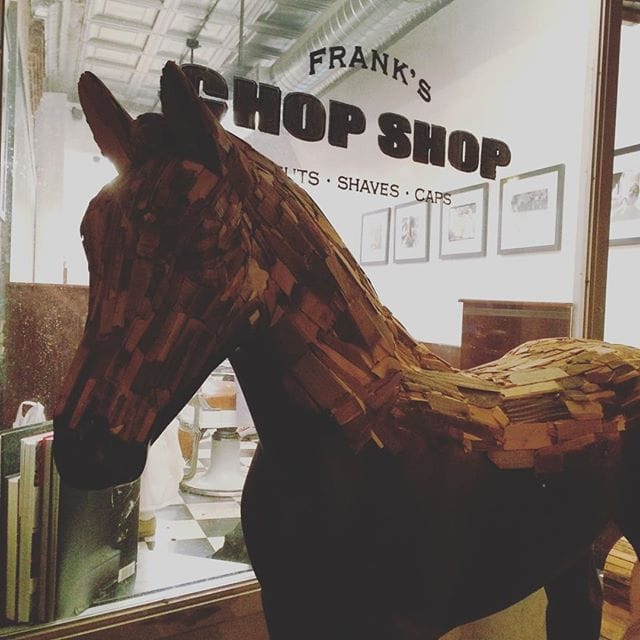 The stolen Mr. Brainwash sculpture outside local barbershop Frank's Chop Shop, where the thieves brought it (photo by @alesandrome/Instagram)