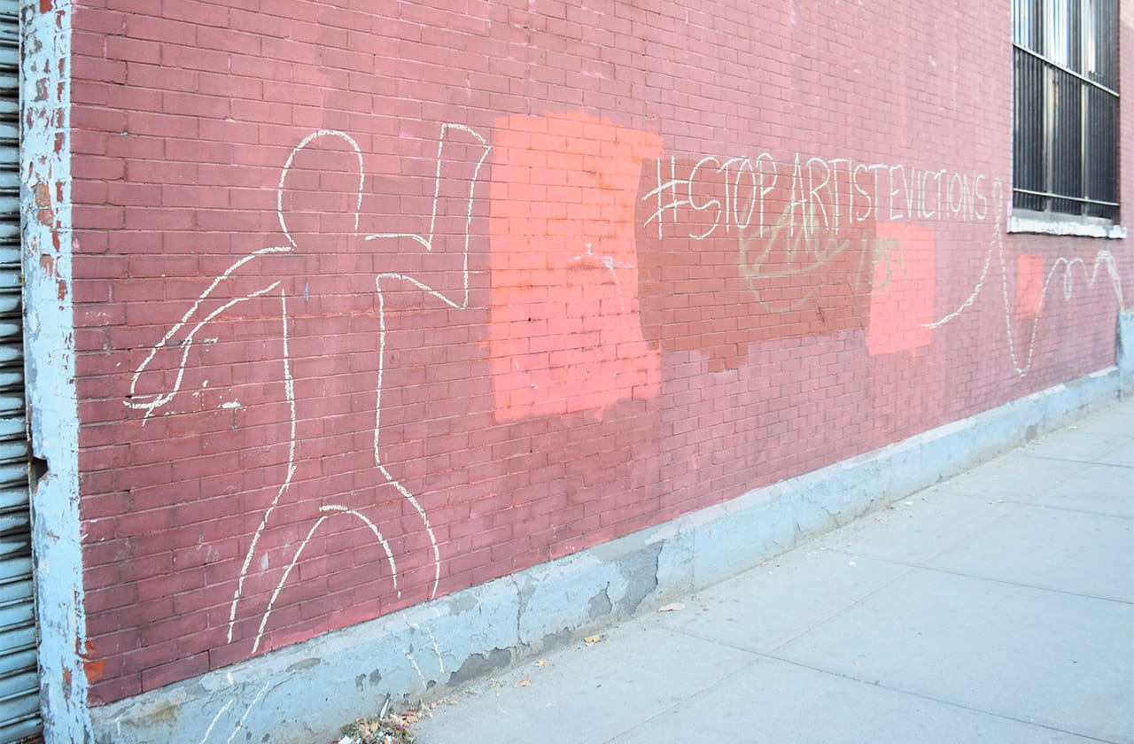 A chalk mural protesting the mass eviction of artists from a building in Gowanus