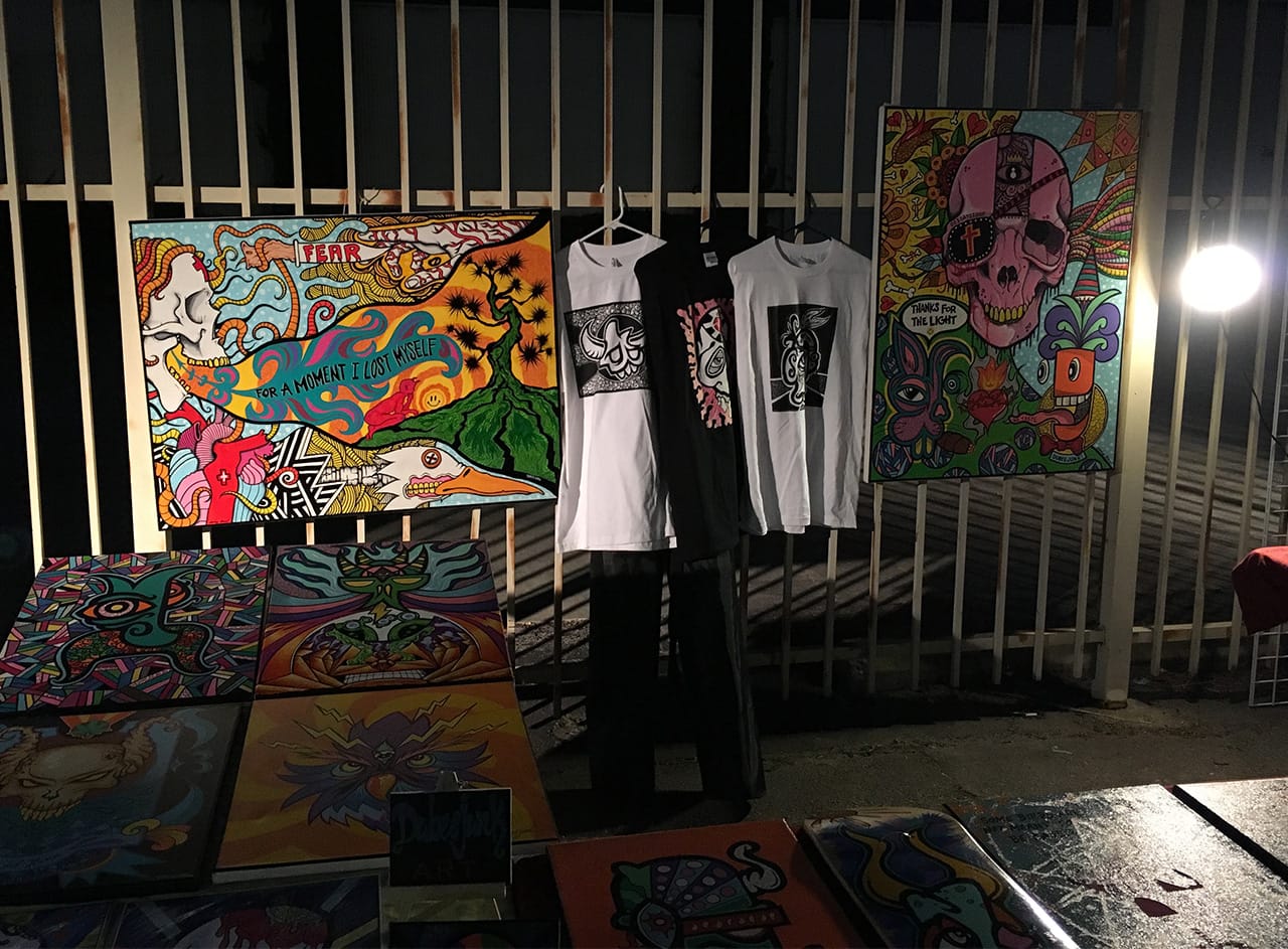 Booth of artwork by artist Erick Yanez at ‘Ambularte’ mobile art exhibit in Boyle Heights, Los Angeles