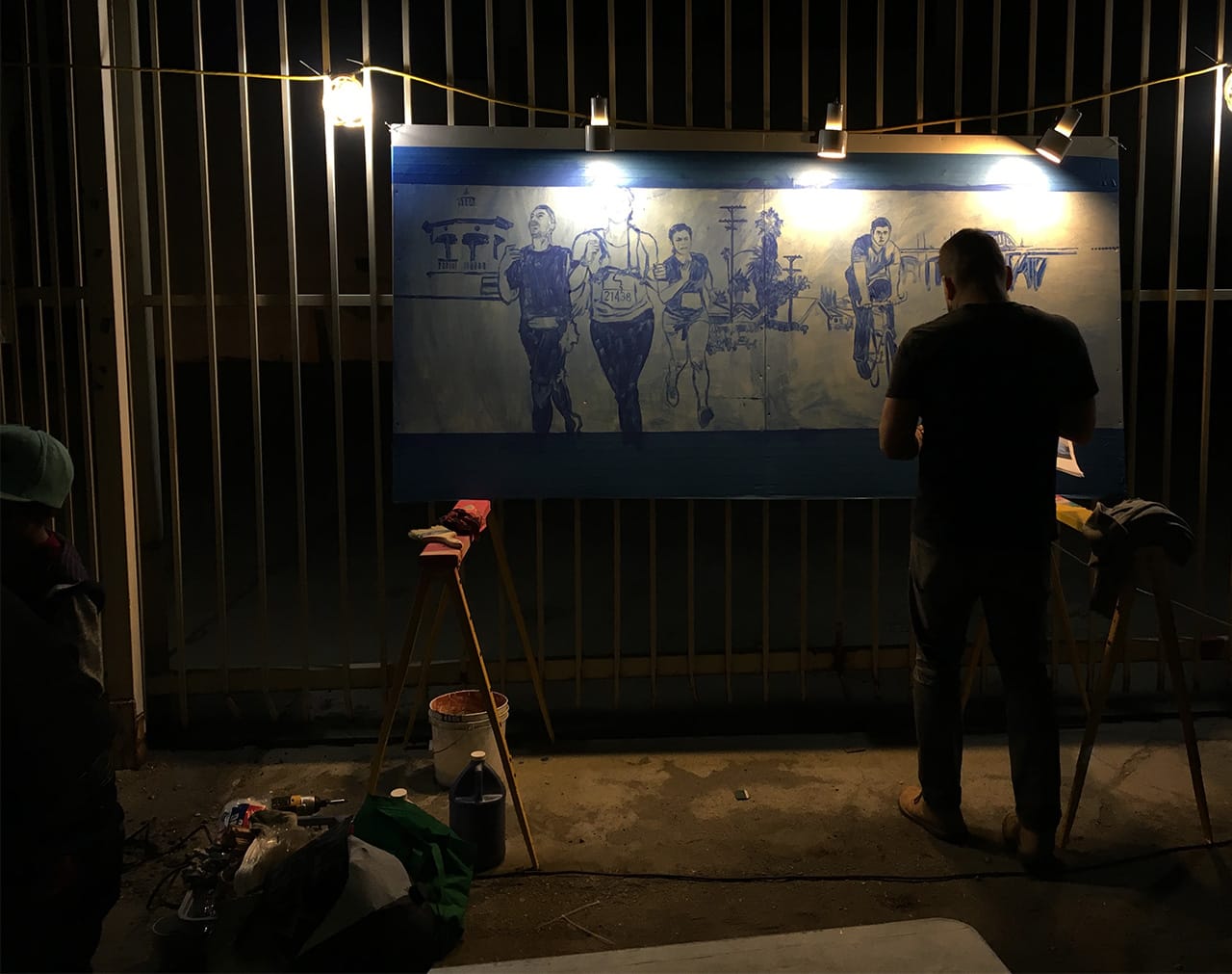 Artist Ray Vargas at work on a painting at ‘Ambularte’ mobile art exhibit in Boyle Heights, Los Angeles