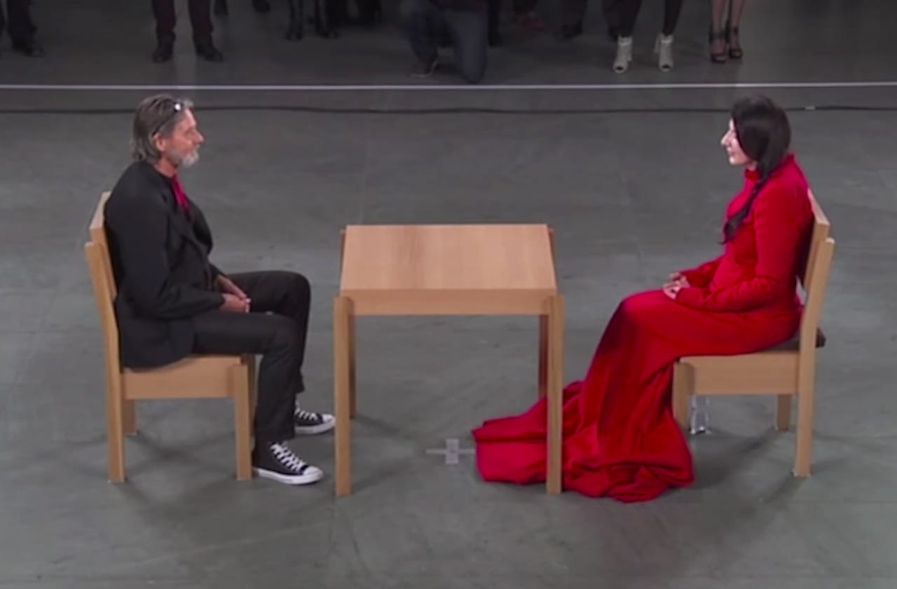 Marina Abramović and Ulay face off during the former's performance "The Artist Is Present" at the Museum of Modern Art in 2010. (screenshot via YouTube)