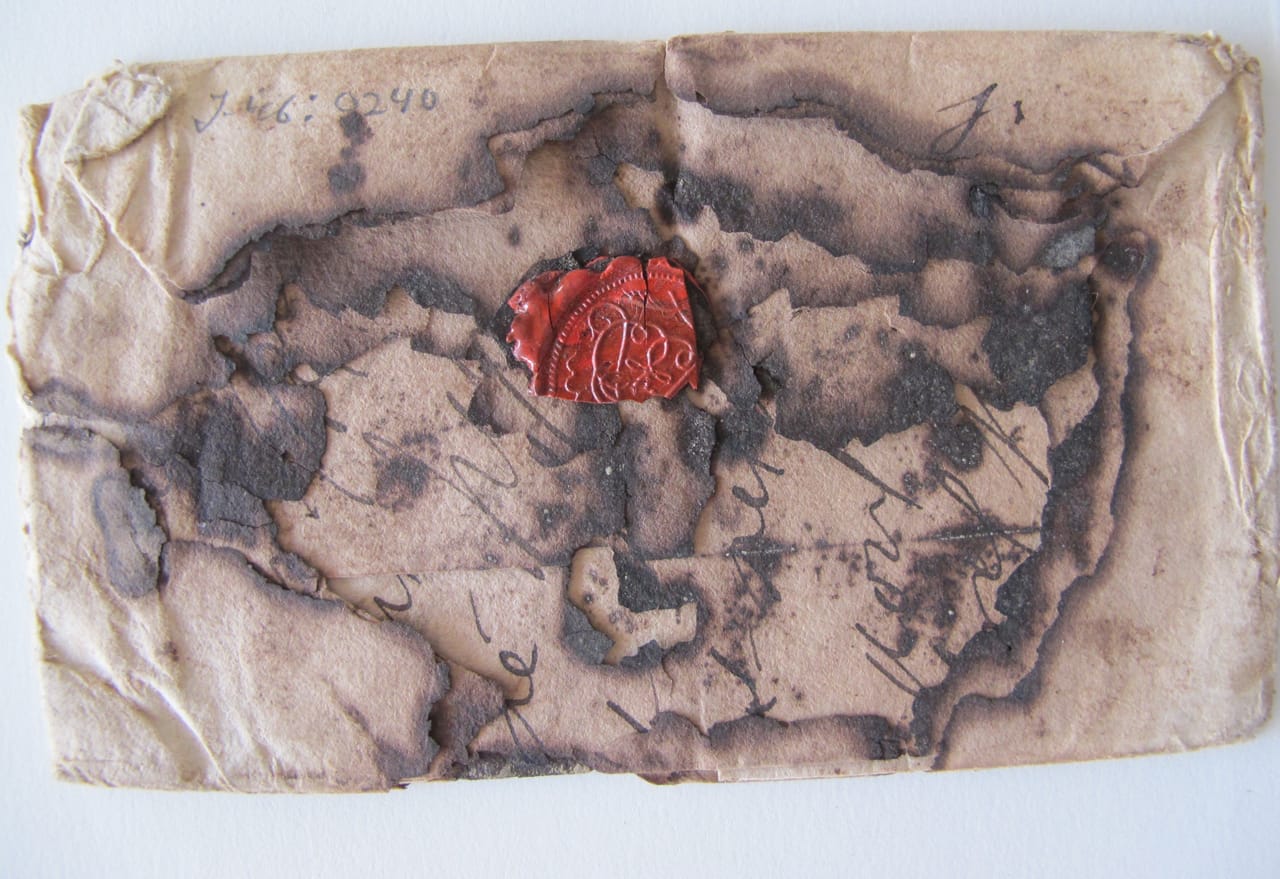 A burnt letter (© Signed, Sealed & Undelivered Team, 2015. Courtesy of the Museum voor Communicatie, The Hague, The Netherlands)