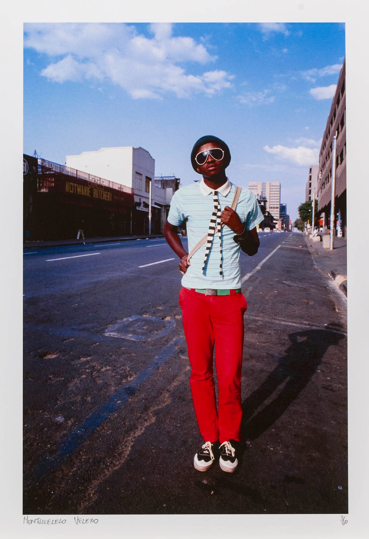 Nontsikelelo “Lolo” Veleko, "Kepi in Bree Street" (2006), from the 'Beauty Is in the Eye of the Beholder' series, digital print with pigment dyes on cotton paper, 16 9/16 x 11 7/16 in, National Museum of African Art, Smithsonian Institution, purchased with funds provided by the Annie Laurie Aitken Endowment (photo by Franko Khoury) (click to enlarge)