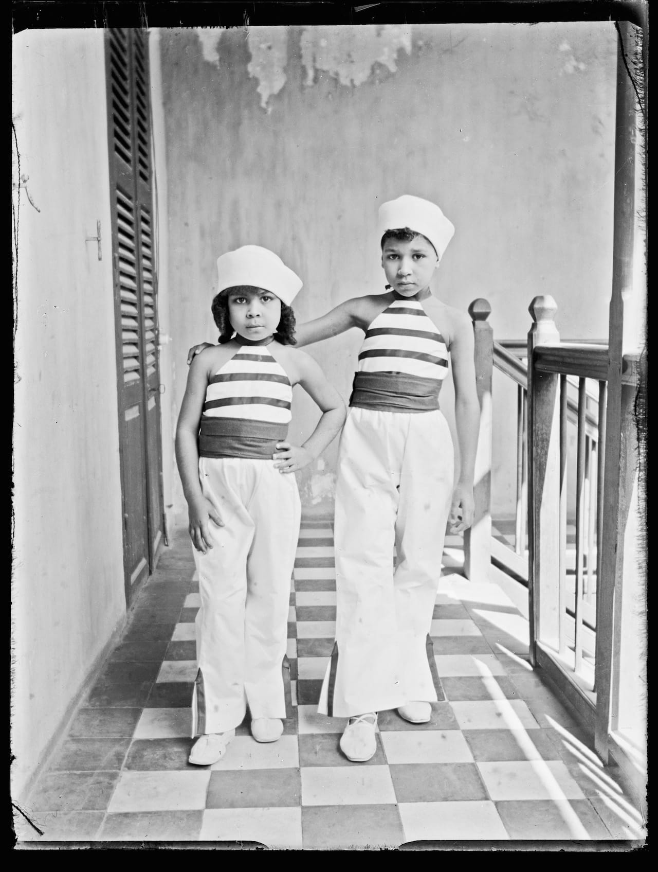 Unknown Artist (Senegal) Two Girls, Indoors, ca. 1915 Gelatin silver print from glass negative, 2015 2 x 3 in (5.7 x 7.6 cm) Visual Resource Archive, Department of the Arts of Africa, Oceania, and the Americas