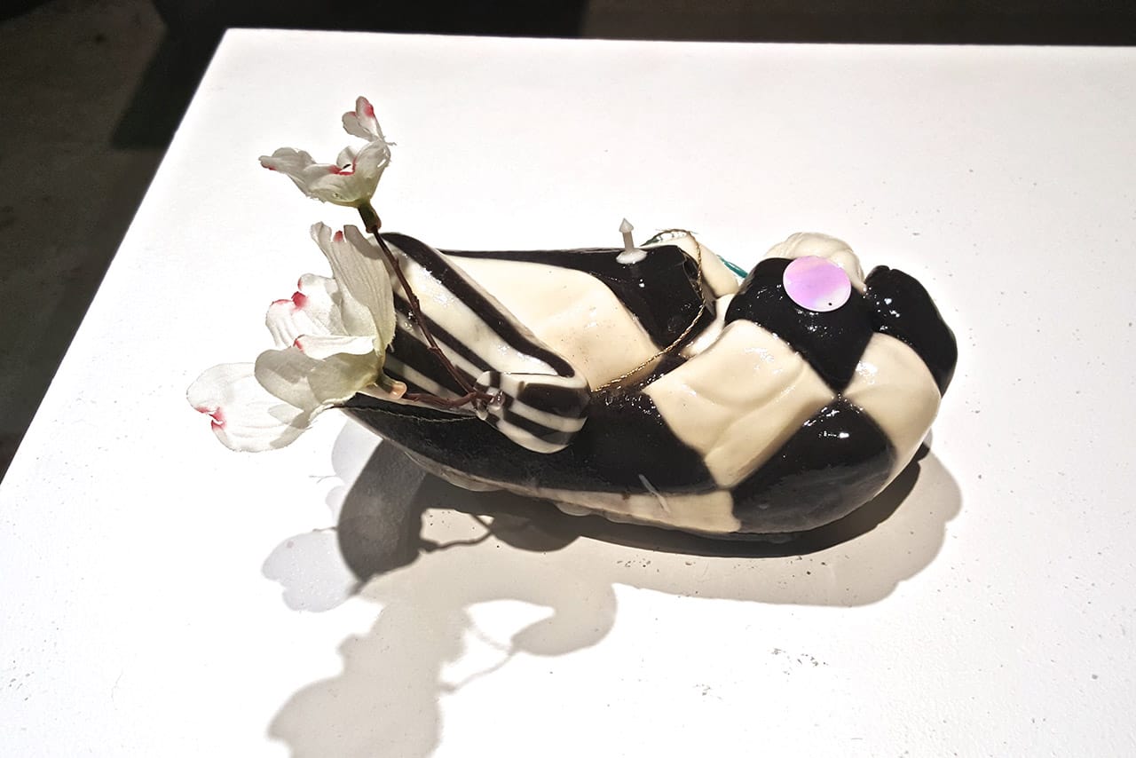 "Checkered Swan Vase" (2015), lacquered candy, hot glue, sequin, plastic, gold string, fake flower (all photos by the author for Hyperallergic)