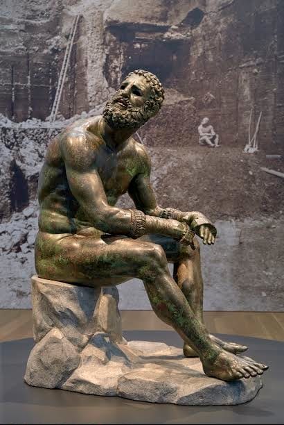 Seated Boxer, “The Terme Boxer,” 300-200 B.C., bronze and copper. Museo Nazionale Romano—Palazzo Massimo alle Terme, Rome. Su concessione del Ministero dei beni e delle attività culturali e del turismo—Soprintendenza Speciale per il Colosseo, il Museo Nazionale Romano e l’area archeologica di Roma. Photo Courtesy of the J. Paul Getty Trust