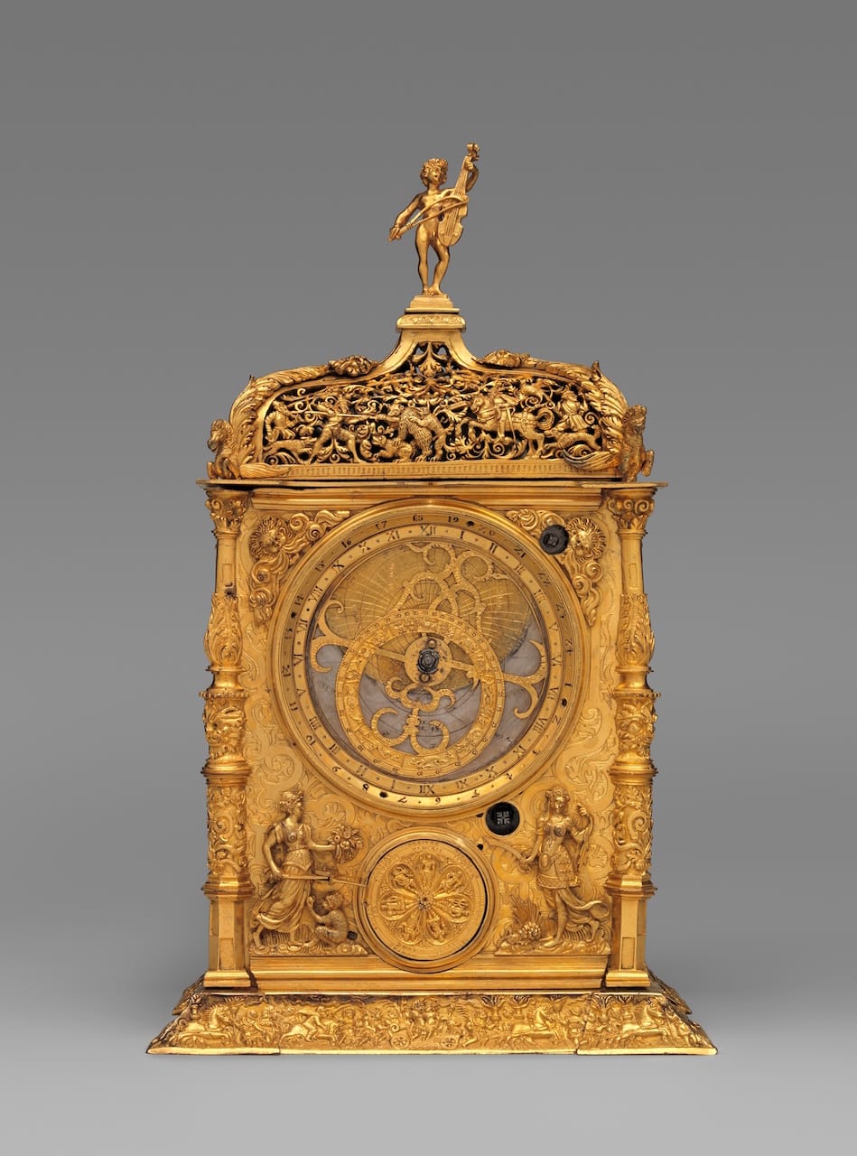 Astronomical table clock Maker: Movement probably by Jeremias Metzger (German, ca. 1525–ca. 1597) Maker: Signed by Caspar Behaim (Chasparus Bohemus) (Austrian, active 1568–84) 1568 Culture: German, Augsburg Medium: Case and dials: gilded brass; Movement: iron post and frame Dimensions: Overall: 14 1/4 × 8 1/4 × 5 3/4 in. (36.2 × 21 × 14.6 cm) The Metropolitan Museum of Art, Credit Line: Gift of J. Pierpont Morgan, 1917