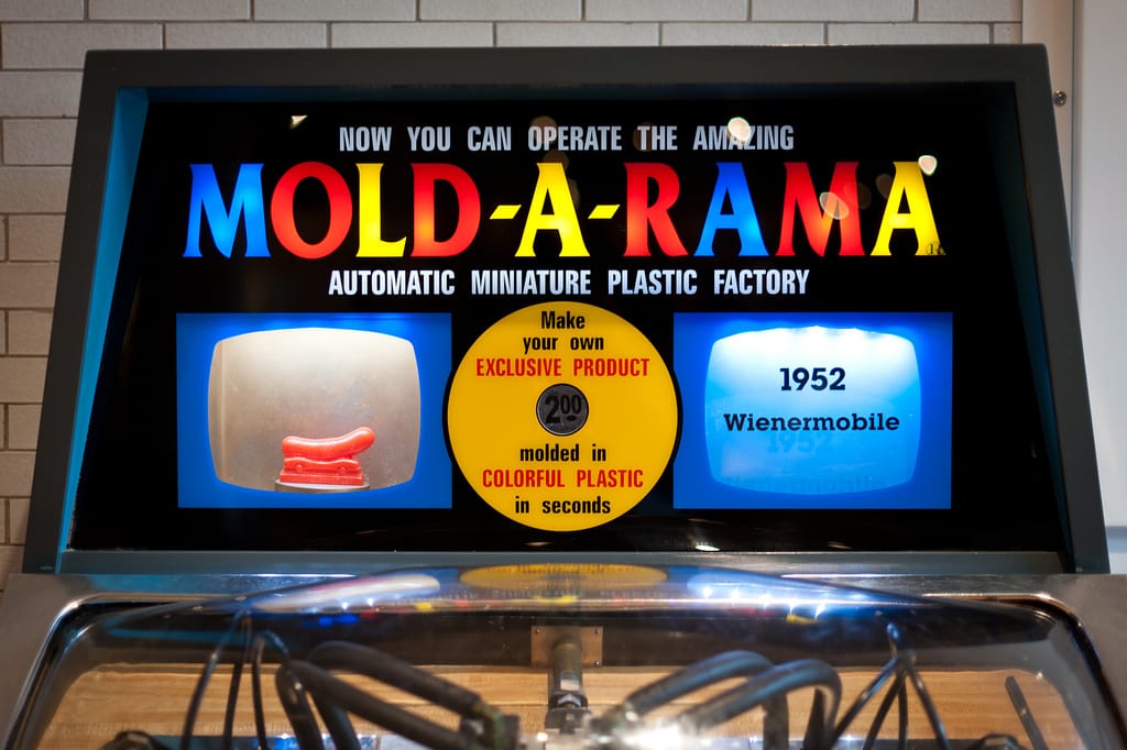 A Mold-A-Rama machine with a Wienermobile in the Henry Ford Museum in Michigan (photo by randychiu/Flickr)