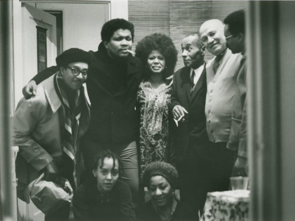 Group portrait by Melvin Edwards of (left to right): Bob Rogers, Ishmael Reed, Jayne Cortez, Léon-Gontran Damas, Romare Bearden, Larry Neal; seated: Nikki Giovanni and Evelyn Neal, in New York City, 1969 (source)