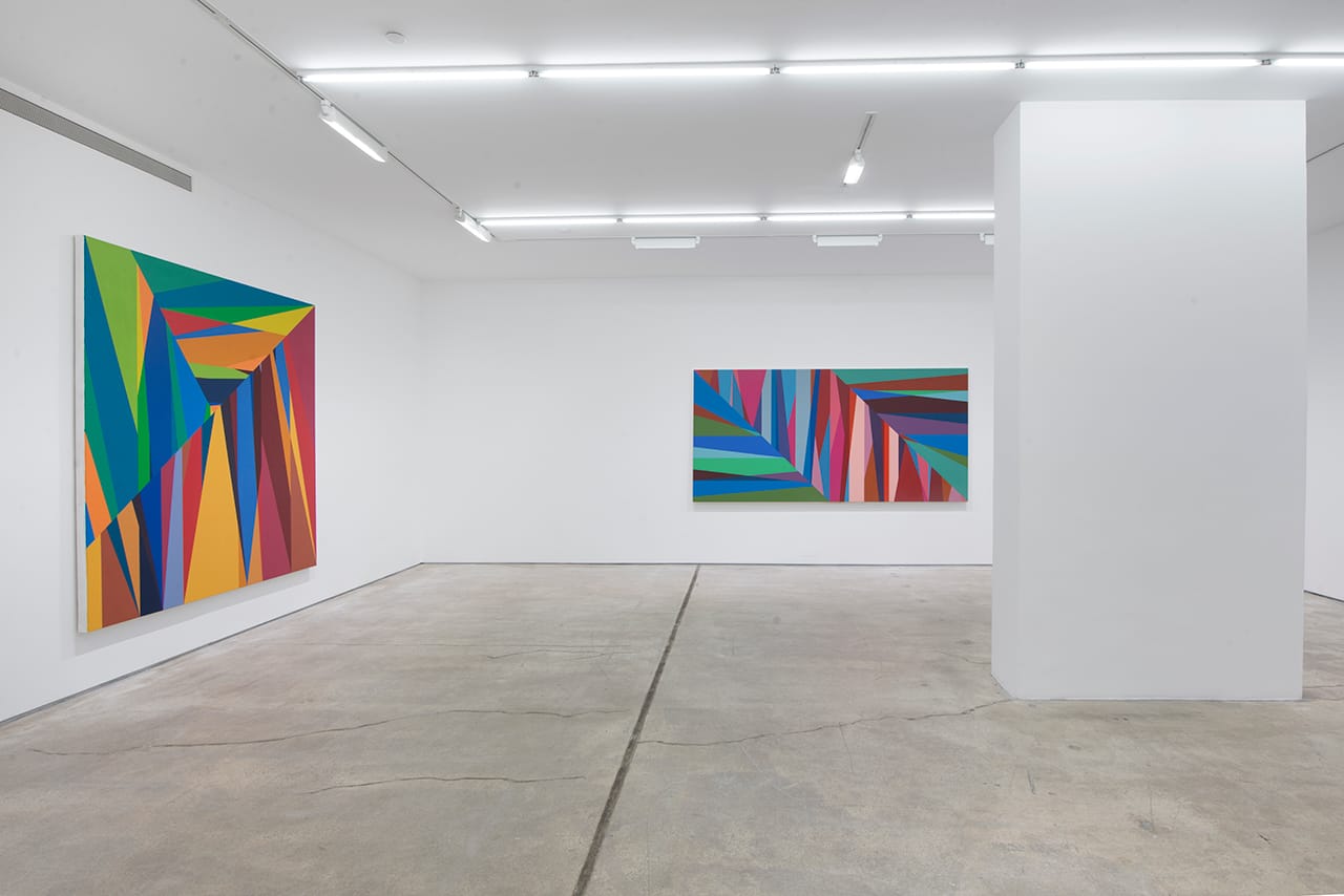 Installation view, 'Odili Donald Odita: The Velocity of Change' at Jack Shainman Gallery, with "The Door to Revolution" (2015) at left and "Chasm" (2015) at right (click to enlarge)