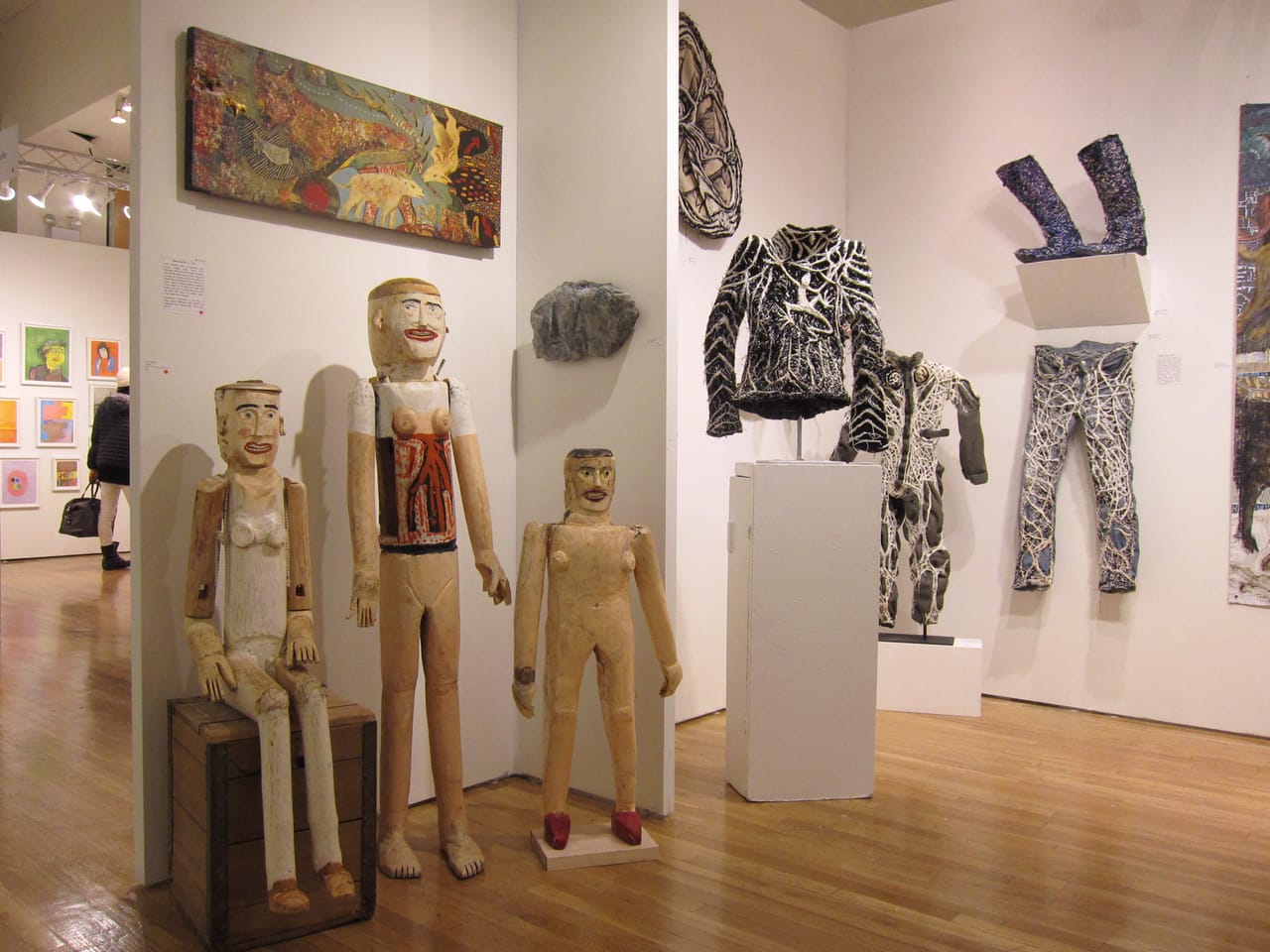 Figural sculptures by John VanZile and clothing works by Robert Adele Davis at American Primitive