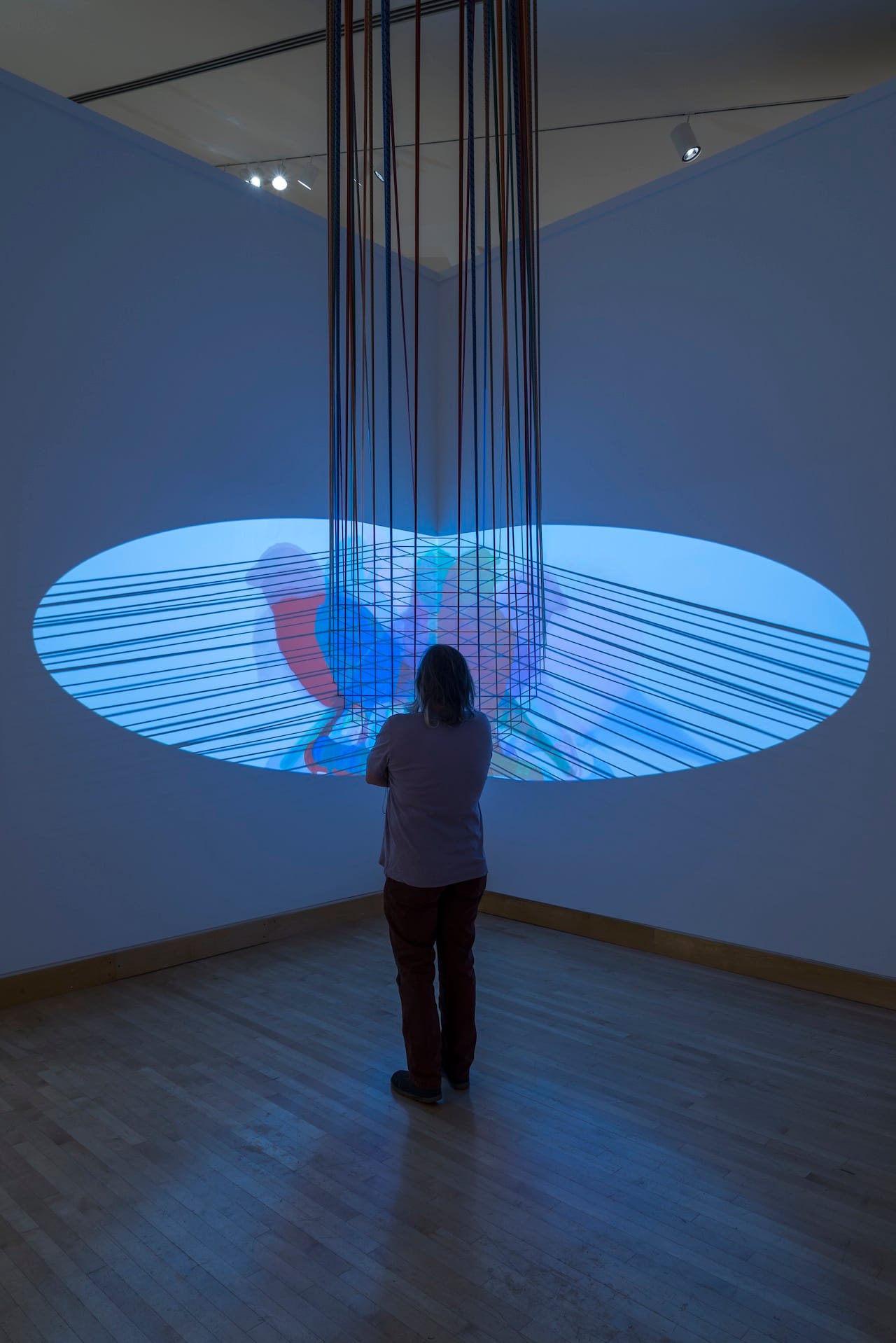 Installation view of Vesa-Pekka Rannikko, "Canary" (2013), two-channel HD video installation, climbing ropes, carabiners, dimensions variable, five-minute loop (photo by E.G. Schempf, courtesy the Kemper Museum of Contemporary Art)