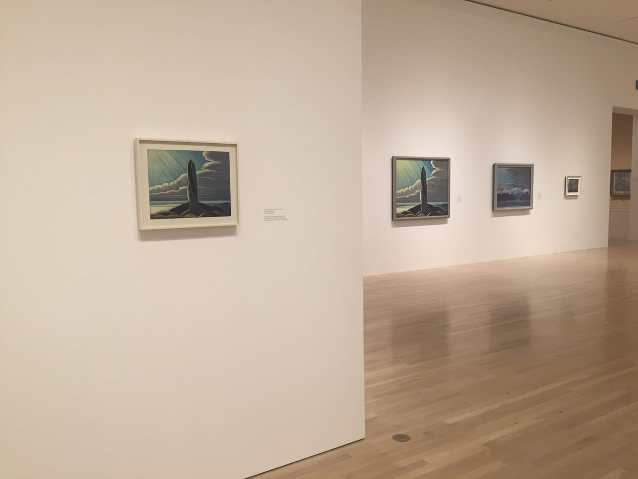 Installation view, 'The Idea of North: The Paintings of Lawren Harris,' featuring "The Old Stump, Lake Superior" (1926) at left and "North Shore Lake Superior" (1926) in the middle (click to enlarge)