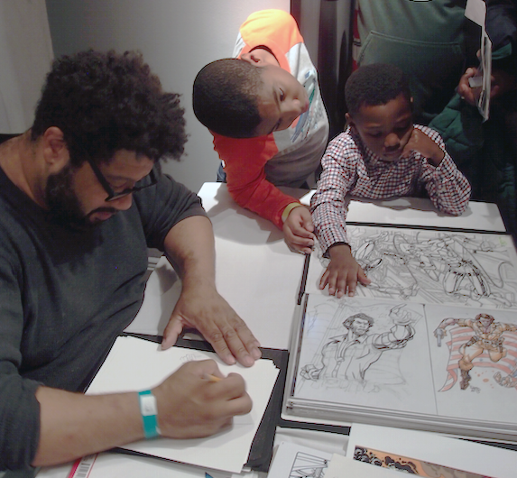 Paris Cullins draws a picture for Bryce & Josiah Adetunji