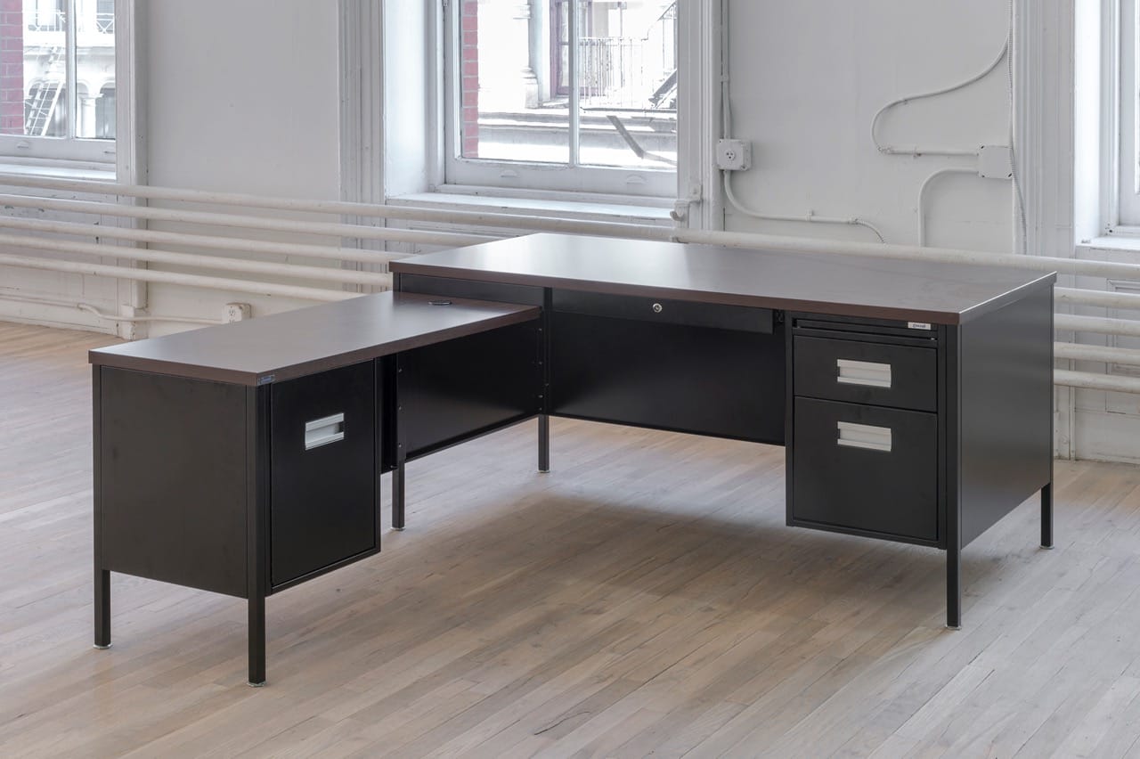 Attica Series Desk, 2016 Steel, powder coating, laminated particleboard, distributed by Corcraft 60   71.5   28.75 inches Rental at cost The Attica Series Desk is manufactured by prisoners in Attica Correctional Facility. Prisoners seized control of the D-Yard in Attica from September 9th to 13th 1971. Following the inmates’ immediate demands for amnesty, the first in their list of practical proposals was to extend the enforcement of “the New York State minimum wage law to prison industries.” Inmates working in New York State prisons are currently paid $0.10 to $1.14 an hour. Inmates in Attica produce furniture for government offices throughout the state. This component of government administration depends on inmate labor. Courtesy of the artist and ESSEX STREET, New York Photo: Adam Reich
