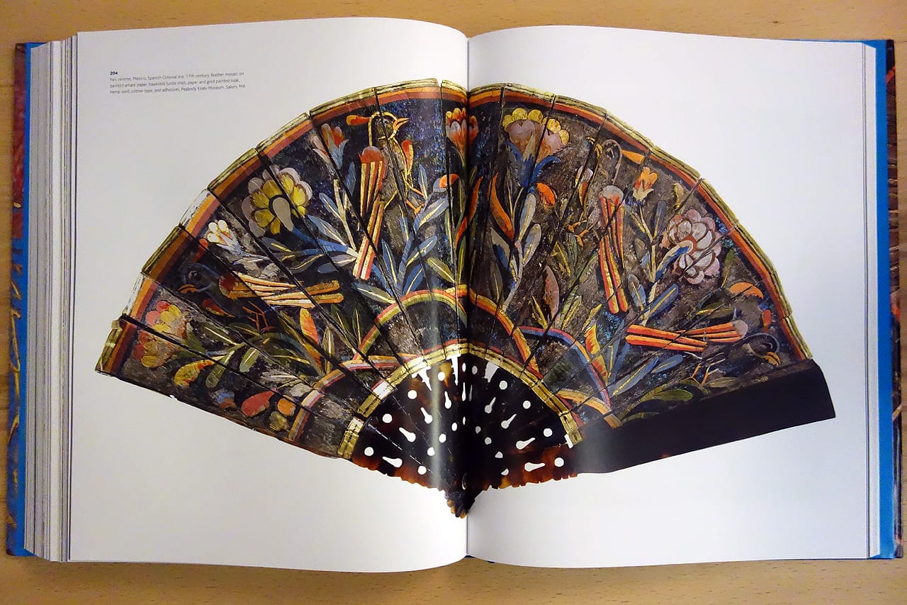 Pages from 'Images Take Flight: Feather Art in Mexico and Europe' (photo of the book for Hyperallergic)
