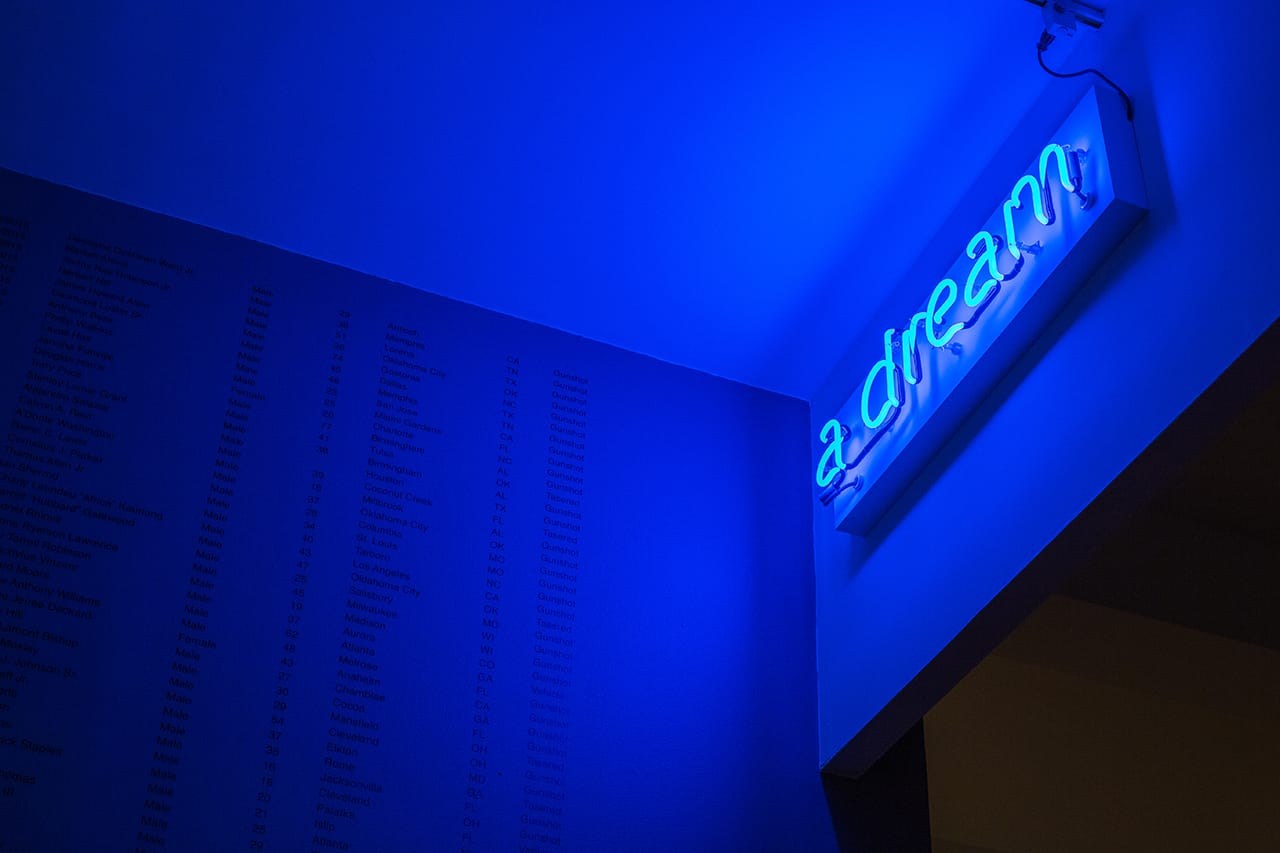 Steve Locke, "A Partial List of Unarmed African-Americans who were Killed by Police or who Died in Police Custody During my Sabbatical from Massachusetts College of Art and Design, 2014-2015" (detail, 2016), paint on wall with vinyl text, neon, dimensions variable