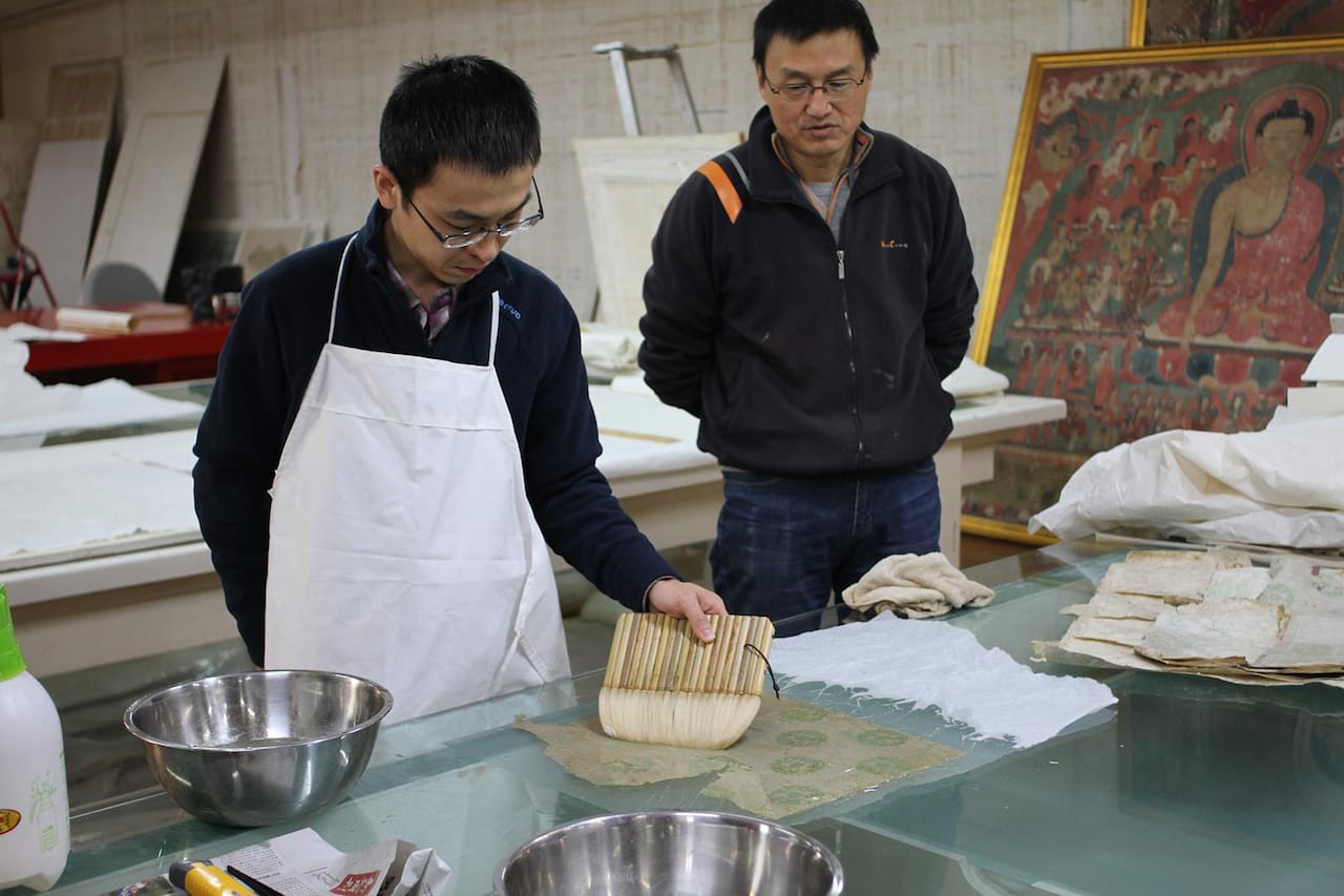 Historic wallpaper testing and conservation for Qianlong Garden (2011-12) (courtesy Palace Museum/World Monuments Fund)