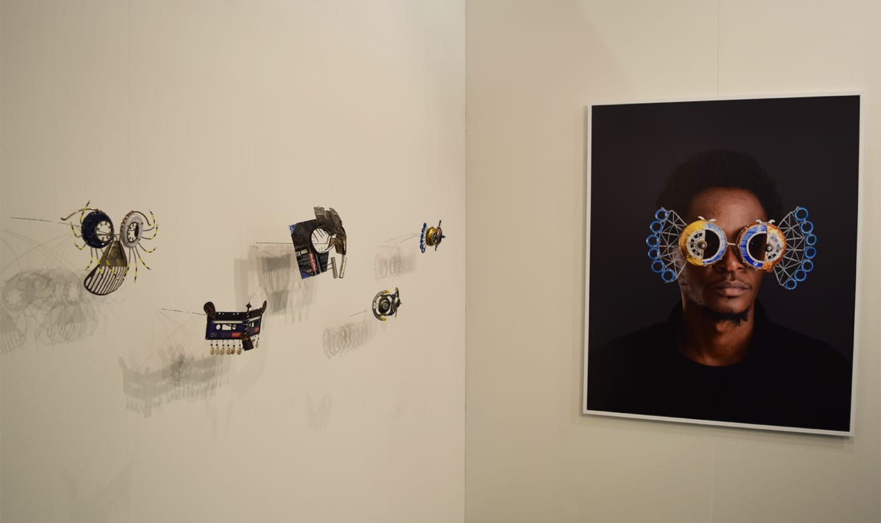 Sculptures and a photograph by Cyrus Kabiru in the SMAC Gallery booth at the 2016 Armory Show