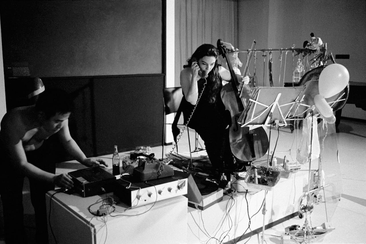 Charlotte Moorman performs John Cage’s "26’1.1499” for a String Player" at opening celebration for Art by Telephone, Museum of Contemporary Art Chicago, October 31, 1969 (photo © Museum of Contemporary Art Chicago)