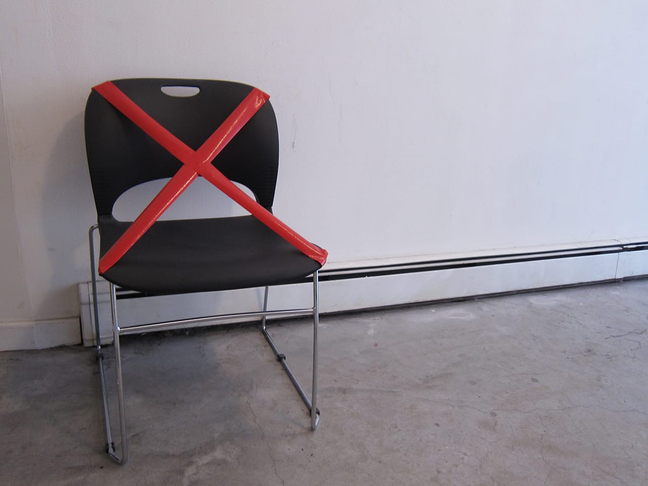 An empty chair to represent and honor those unable to participate in conversations at FIREWALL