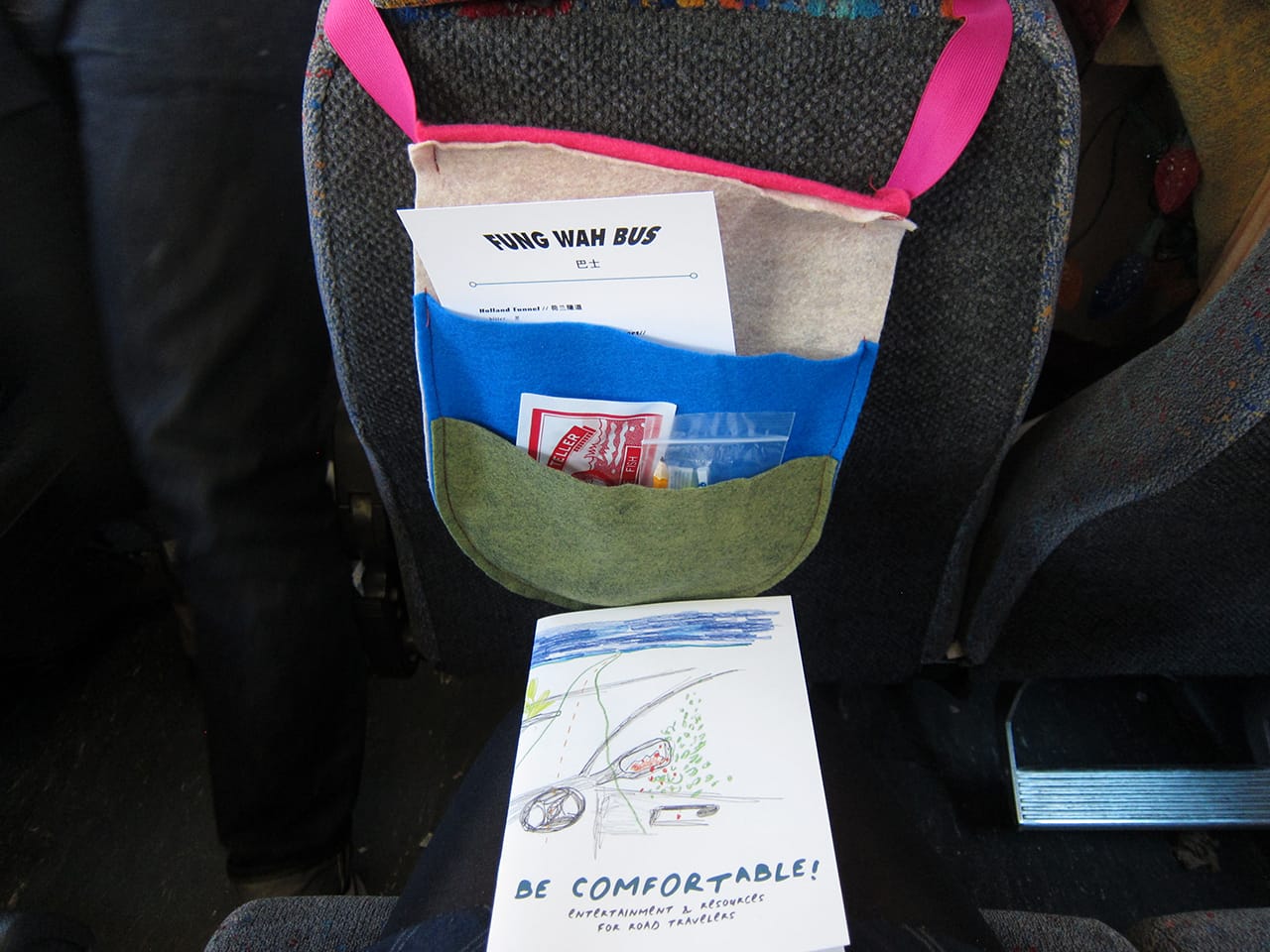 PINES//PALMS, "Resilience of Comfort" (2016), a custom-made seat-back pocket holding travel amenities (all photos by the author for Hyperallergic)