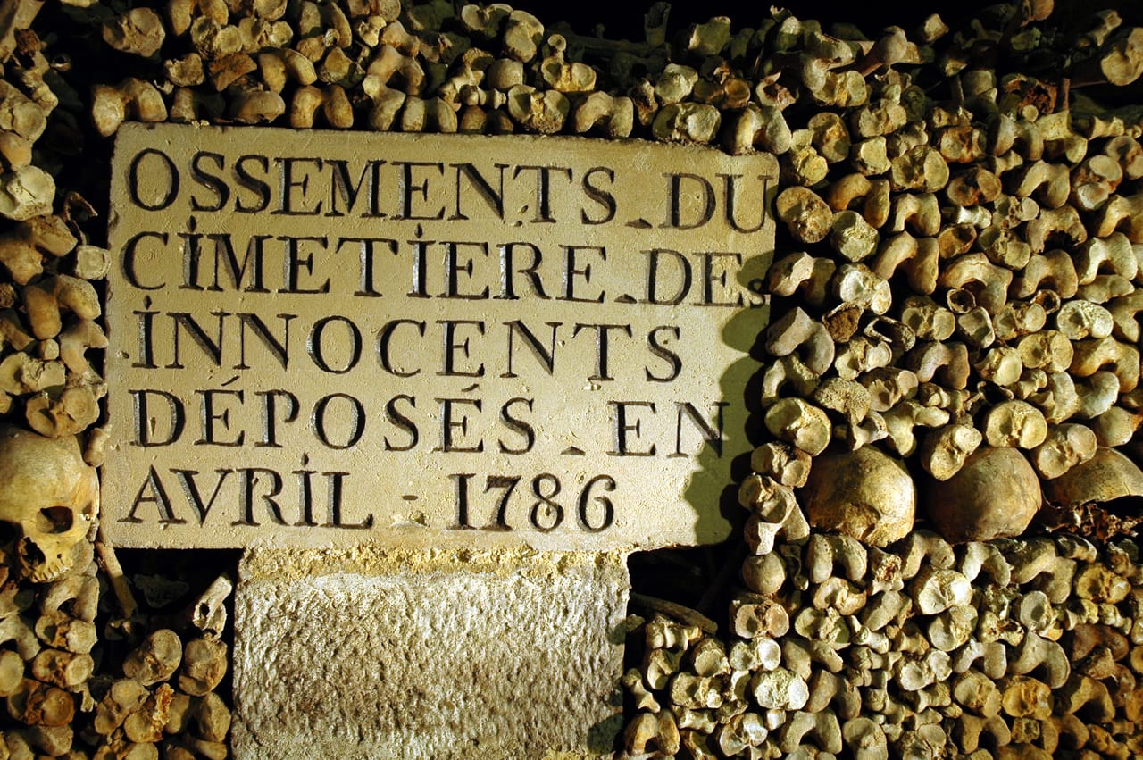 An engraving marking the bones brought into the Paris Catacombs from the Cimetière des Innocents (photo © Christophe Fouin)