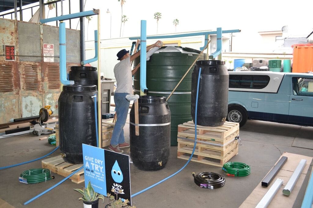 Scoli Acosta working on his Save the Drop installation