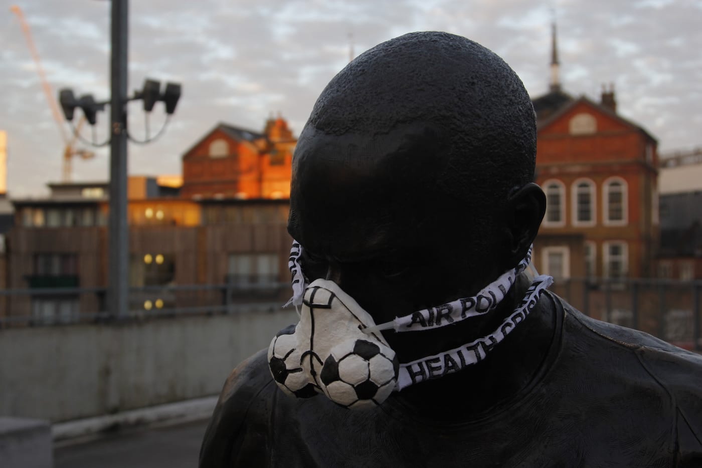 Greenpeace activists fit the statue of Thierry Henry at Emirates Stadium with an emergency face mask to demand action on air pollution. Earlier this morning, a separate Greenpeace team eluded security and climbed over the fence around the Houses of Parliament to put another mask on Oliver Cromwell’s statue. Famous statues of Winston Churchill in Parliament Square, Queen Victoria opposite Buckingham Palace, Eros at Piccadilly Circus and Nelson’s Column at Trafalgar Square, have also been given protection against London’s dirty air by environmental activists.