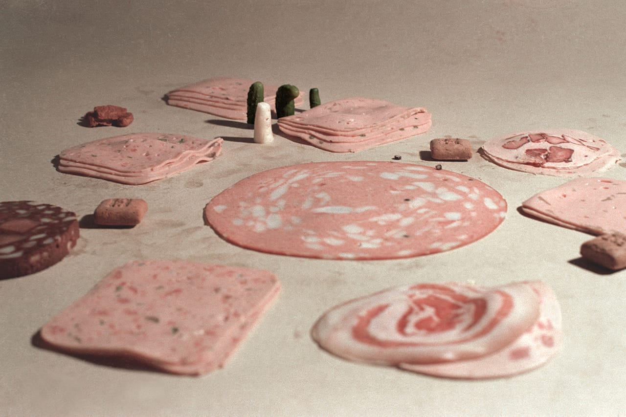 Peter Fischli and David Weiss, "At the Carpet Shop" (from 'Sausage Series,' 1979), chromogenic print, 24 x 36 cm, Walker Art Center, Minneapolis, Clinton and Della Walker Acquisition Fund, 1993 (© Peter Fischli and David Weiss)