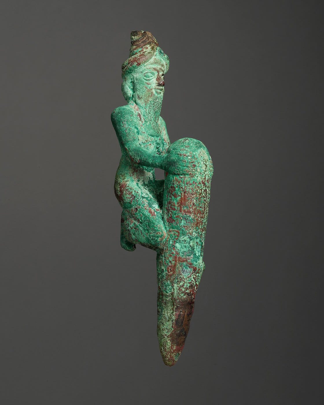 Foundation Figure of a Kneeling God Holding a Peg, Mesopotamia, Second Dynasty of Lagash, reign of Gudea, ca. 2144-2124 B.C., Copper alloy. The Morgan Library and Museum