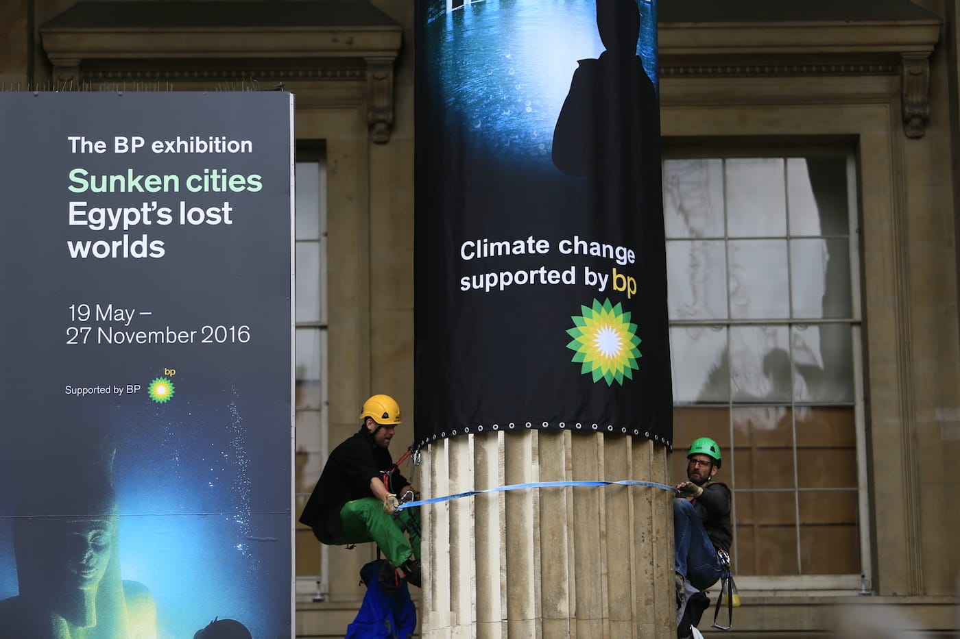Greenpeace activists climb the British Museum in protest at BP’s sponsorship of a new exhibition ‘Sunken Cities’. The climbers unfurl seven huge banners down the front columns of the British Museum. The banners carry the names of cities and regions struck by flooding and climate change disasters.