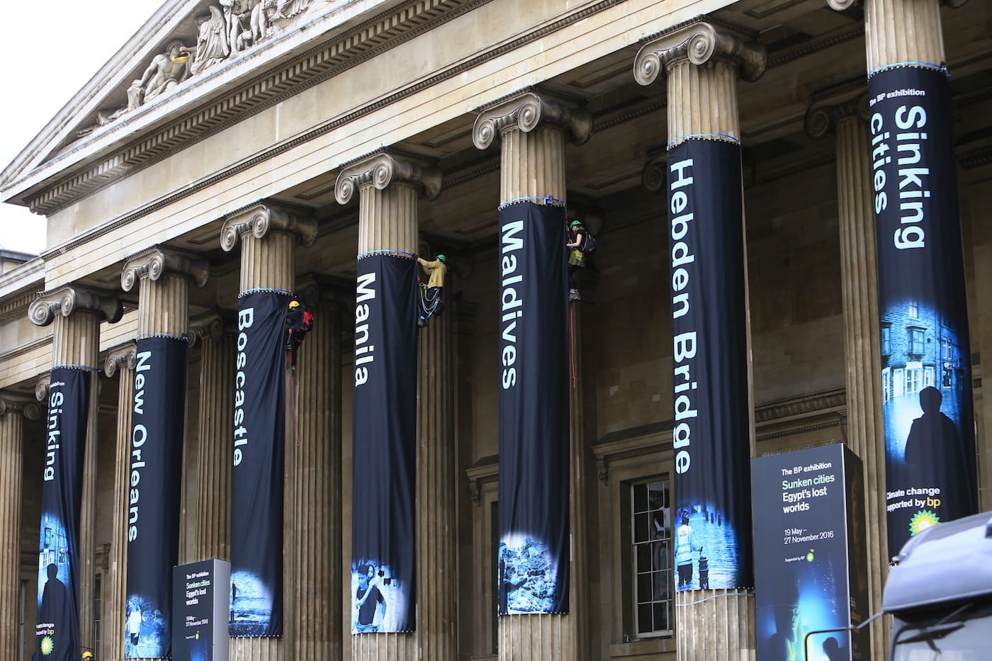 Greenpeace activists climb the British Museum in protest at BP’s sponsorship of a new exhibition ‘Sunken Cities’. The climbers unfurl seven huge banners down the front columns of the British Museum. The banners carry the names of cities and regions struck by flooding and climate change disasters.