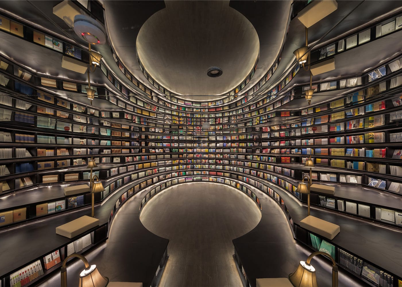 An oval reading room with stepped shelving are among the spaces designed by Shanghai studio XL-Muse for this bookshop in Hangzhou, China. Dezeen has a beautiful slideshow of the space. (via Dezeen)