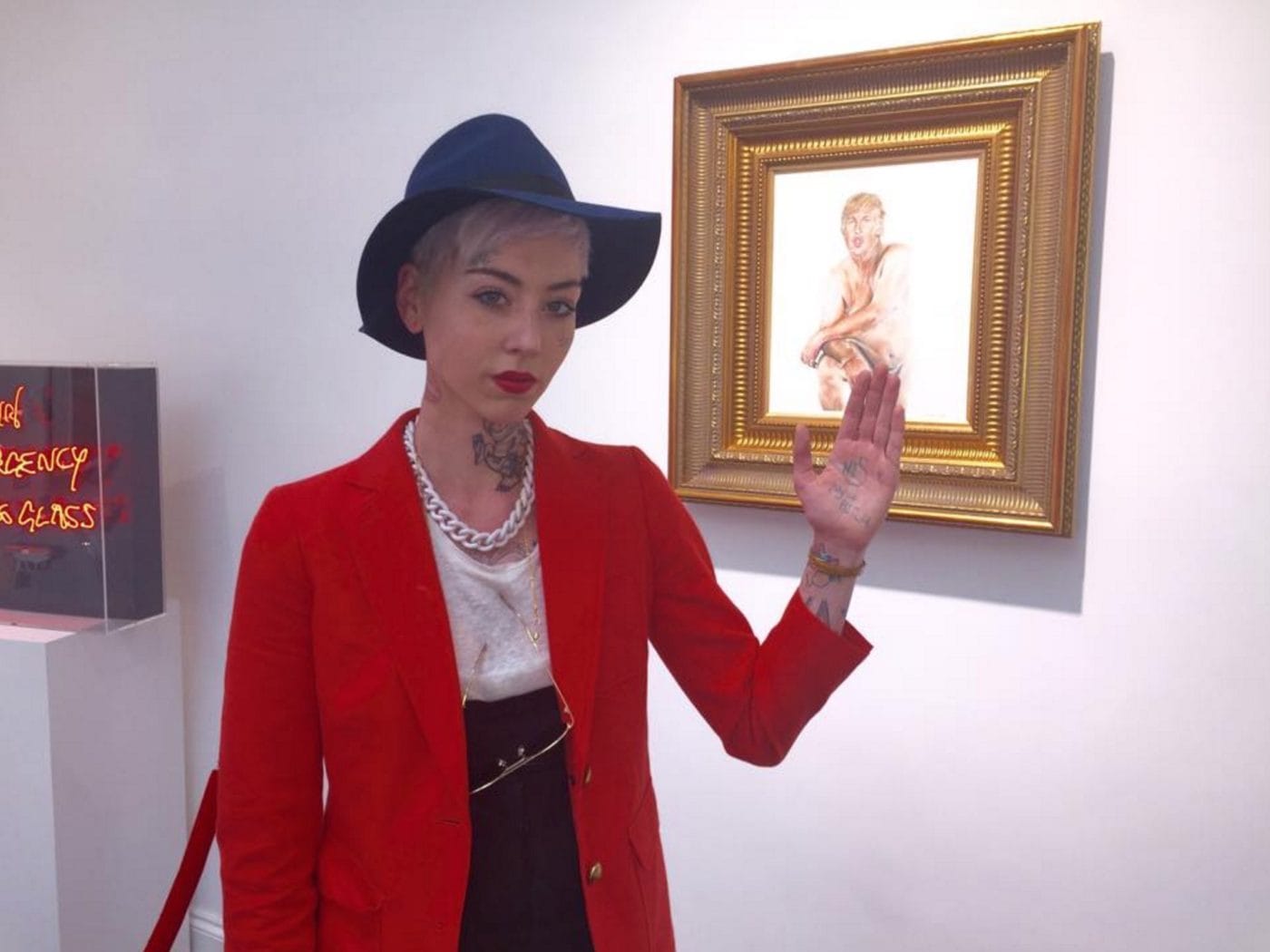 Illma Gore with her Trump portrait at Maddox Gallery (photo courtesy the artist)