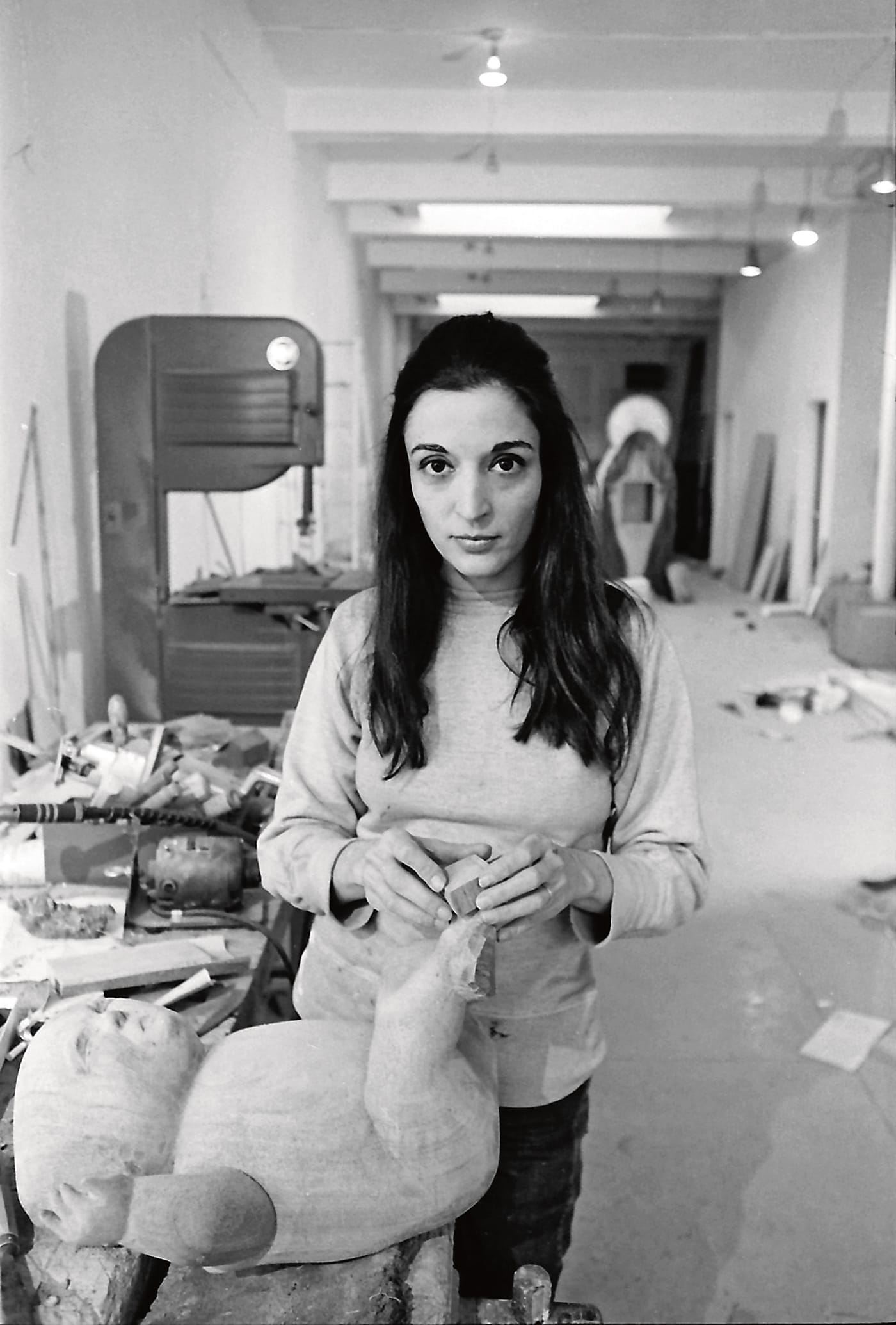 Jack Mitchell, "Portrait of Sculptor Marisol Escobar at Work on & 'The Family' Sculpture" (1969), photograph, Memphis Brooks Museum of Art, Memphis, TN; Museum purchase with funds provided by Marina Pacini and David McCarthy in honor of Mimi Trujillo Ruthizer (© Estate of the artist)