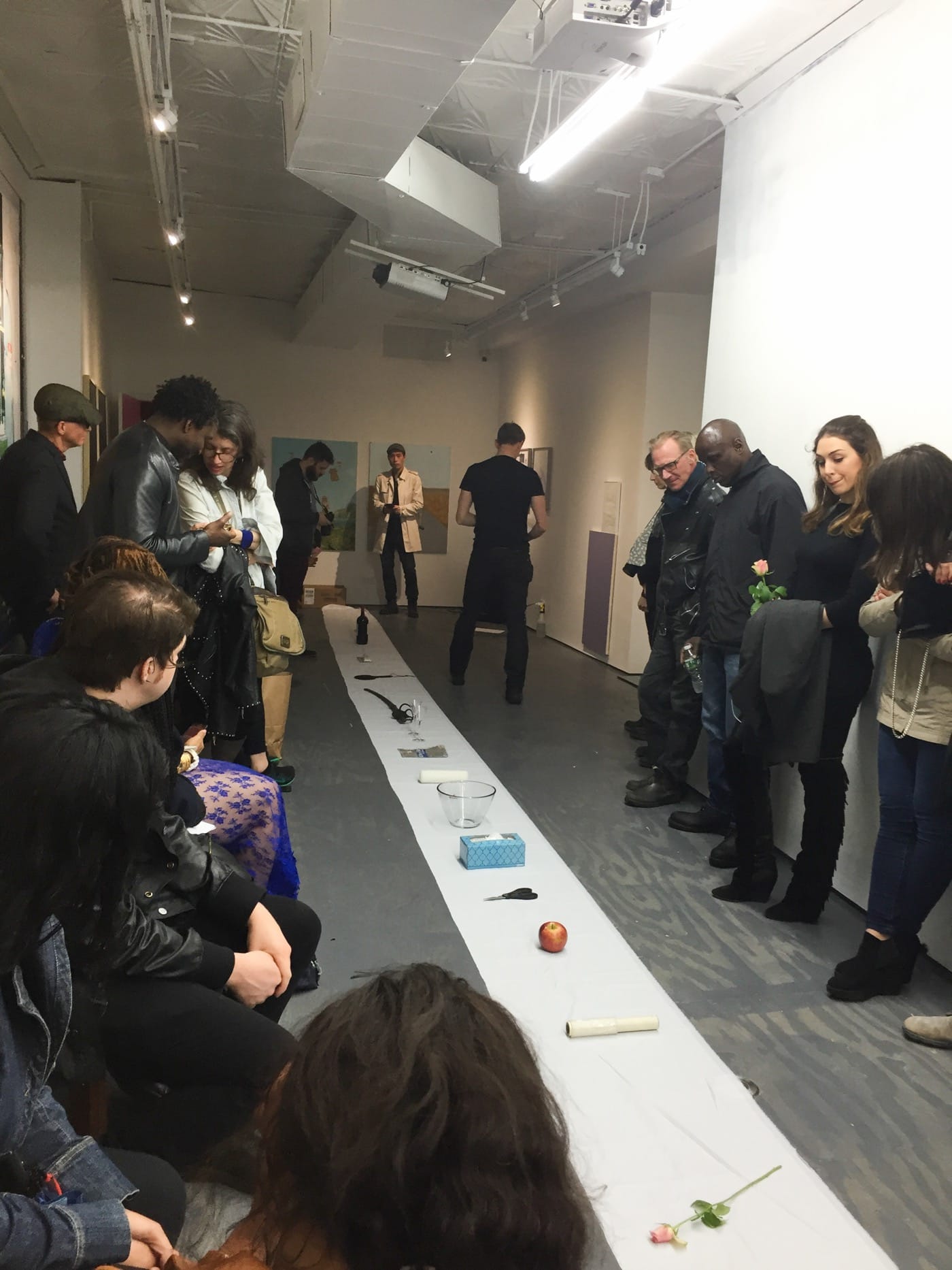 Myk Henry laying out all the objects for potential use in his performance with the audience. Photo by Ventiko