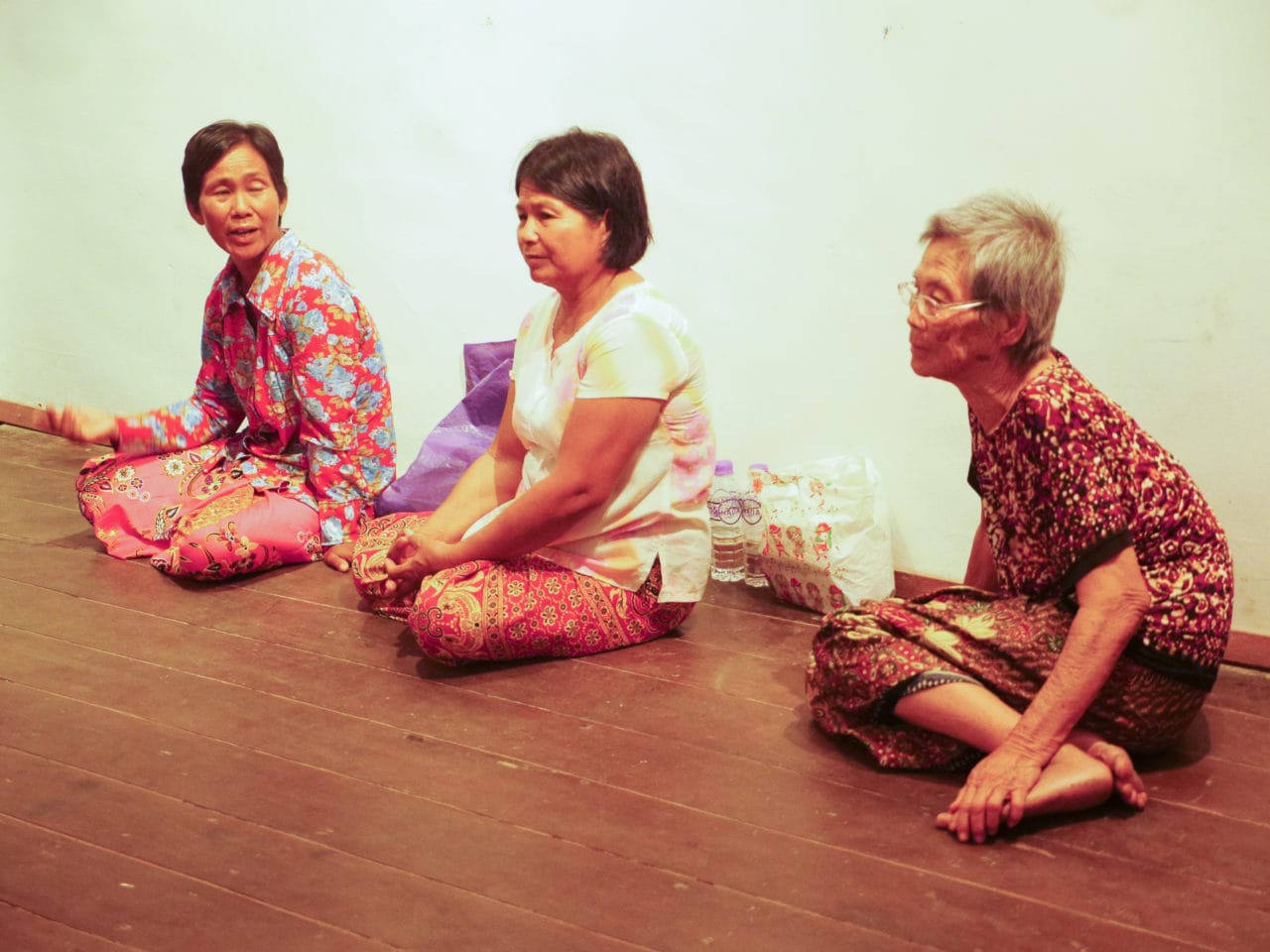 At the gallery, from left to right, Uy Reen, PierSath's sister and Pheng Chanthy, who participated in the project. On the far right is the woman who happened to be invited to the opening.