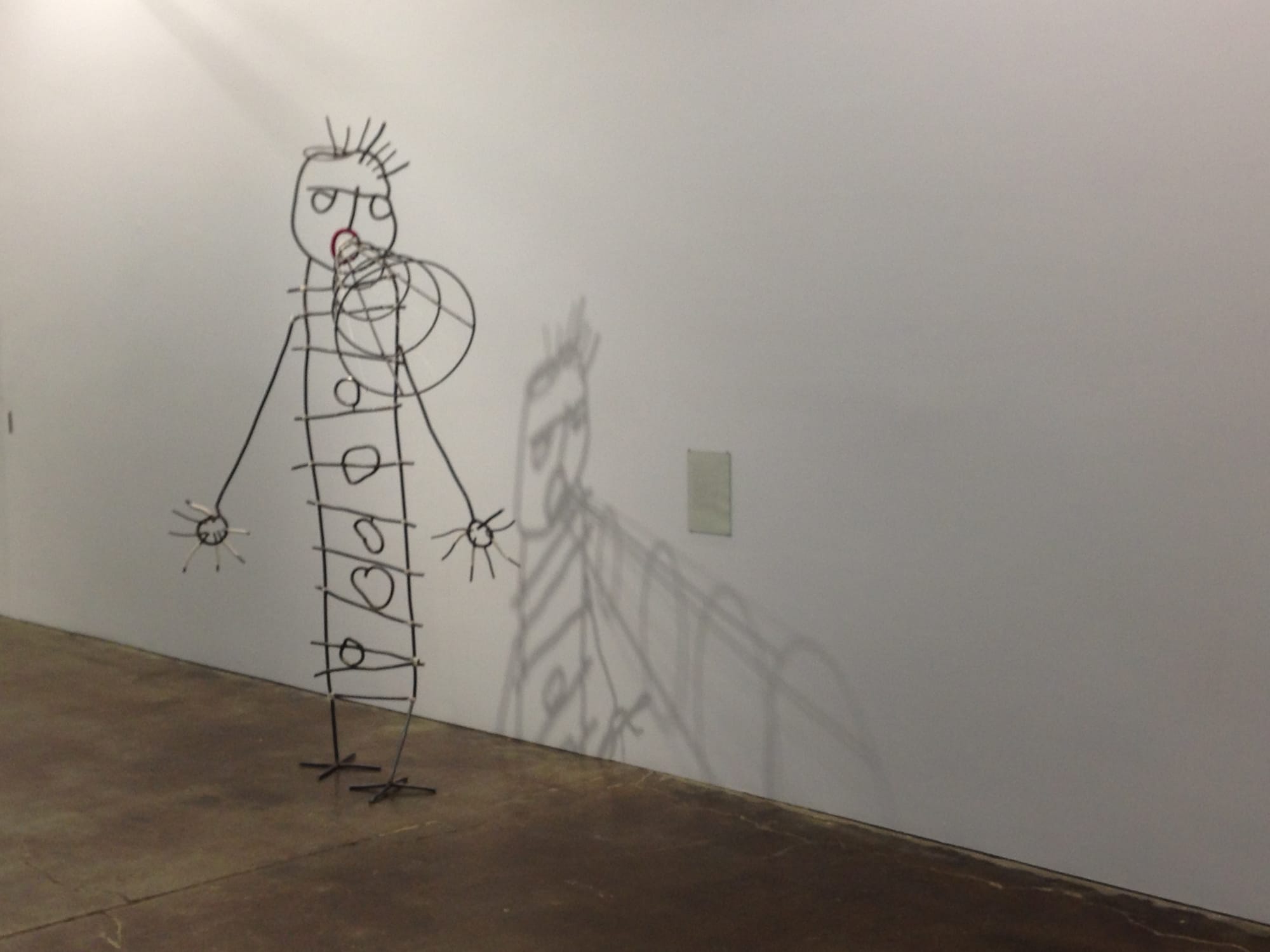 "Preparation for a Speech" (2016), metal, string, paper, and glass, 85 x 44 x 30 inches (photo by the author for Hyperallergic)