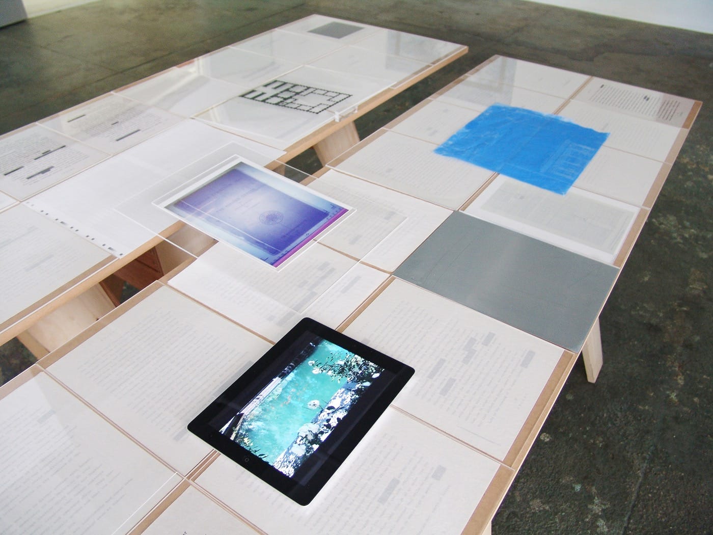 Installation shot of the table displaying Wilber's report on the coup.