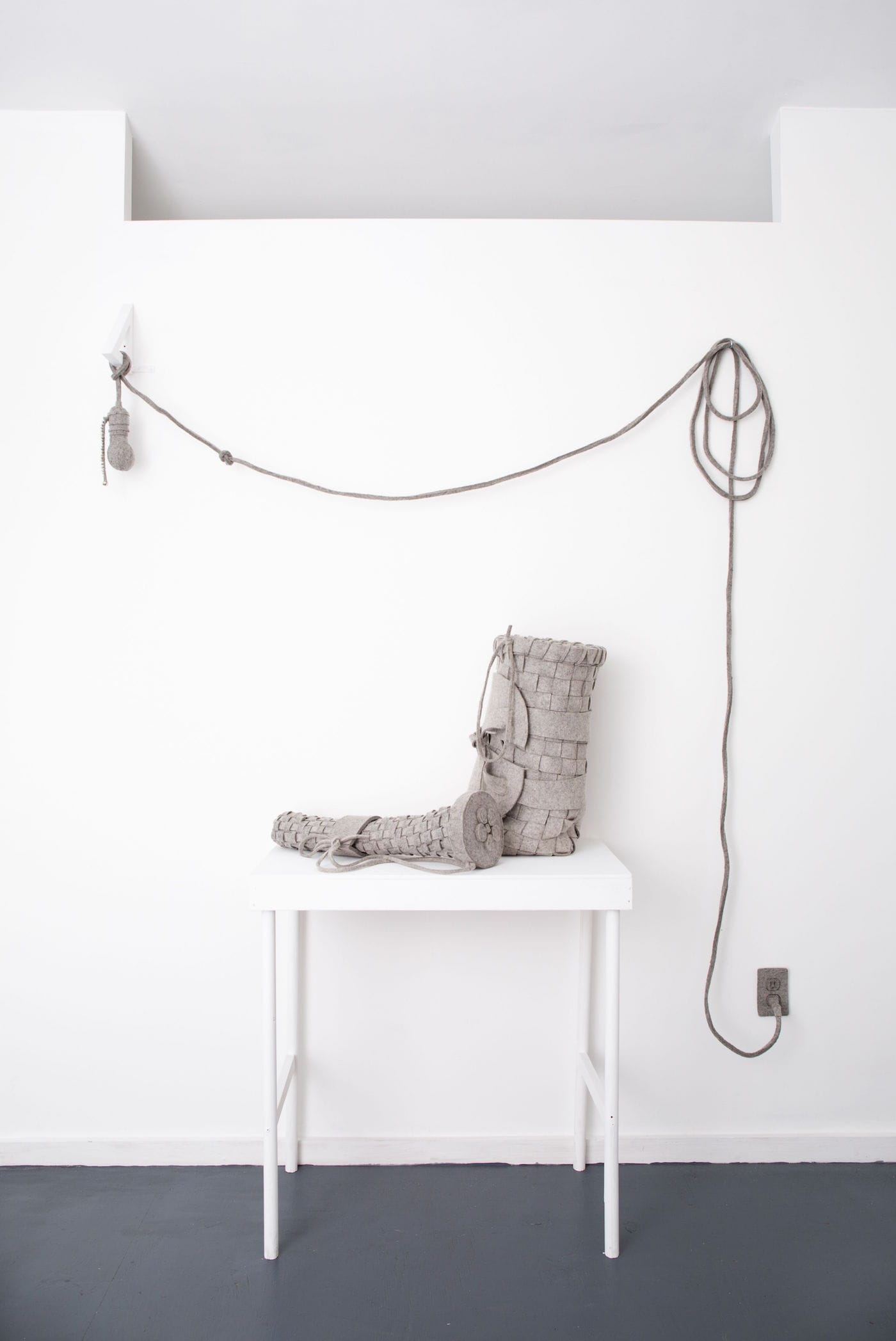 Maria Hupfield, "Bright Ideas Basket Installation with Instructions" (2016), wall installation with table, industrial felt, small jingle bells, thread, and polyfil, dimensions variable